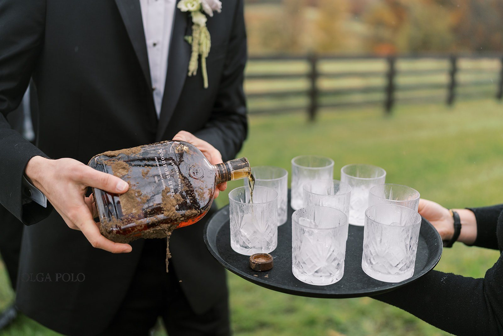 Bourbon being poured for the wedding party outdoors at Boone Valley Farm