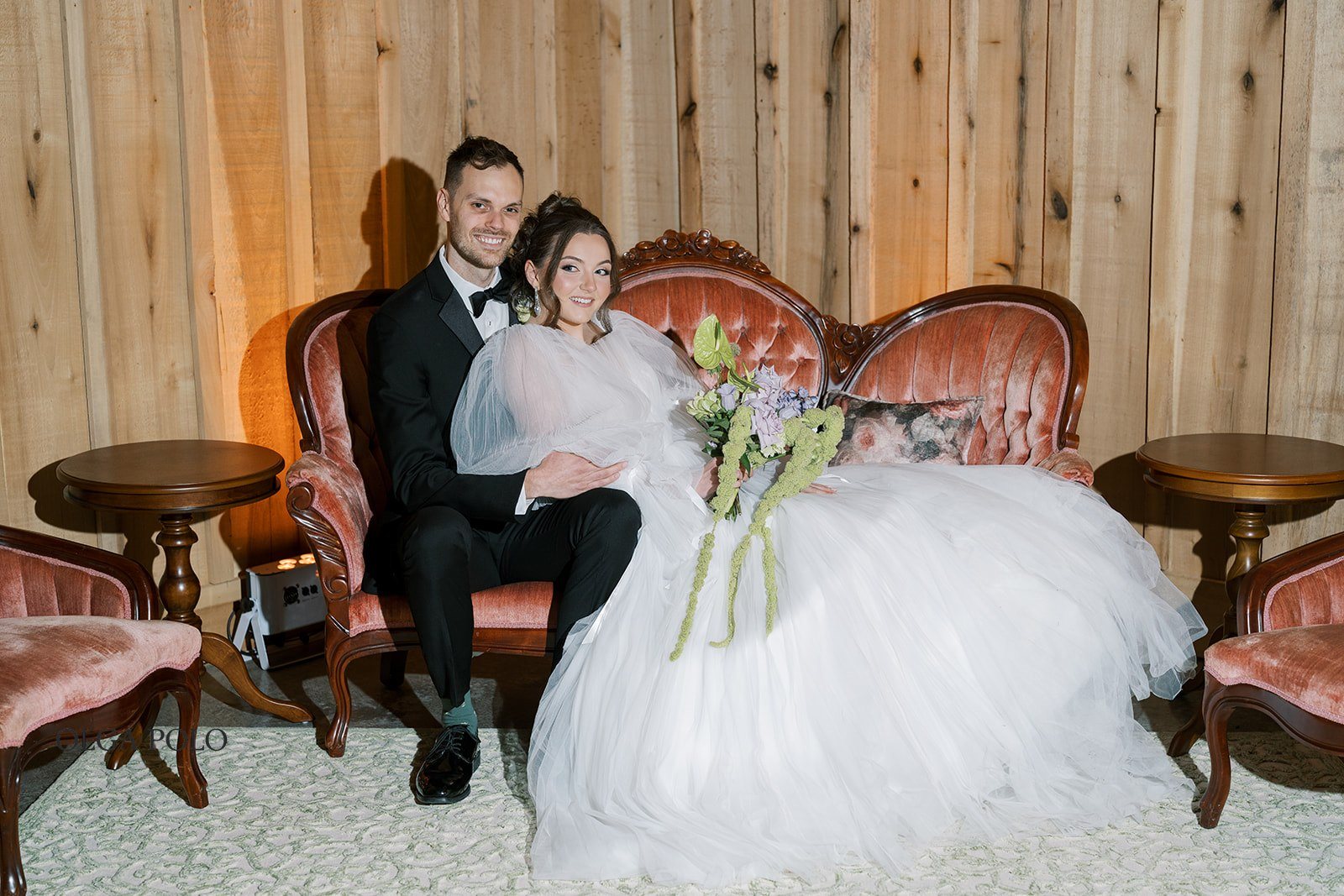 Maia and Troy seated together in a lounge setting at Boone Valley Farm