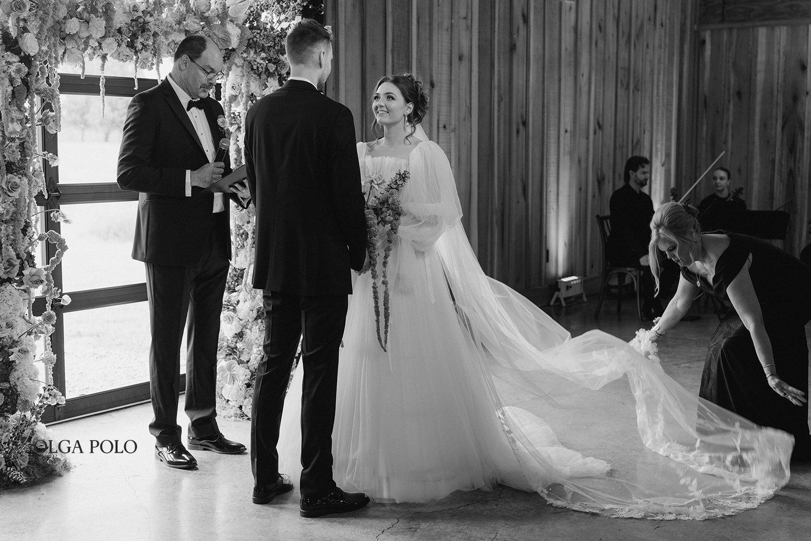 Maia and Troy at the front of the ceremony before exchanging vows