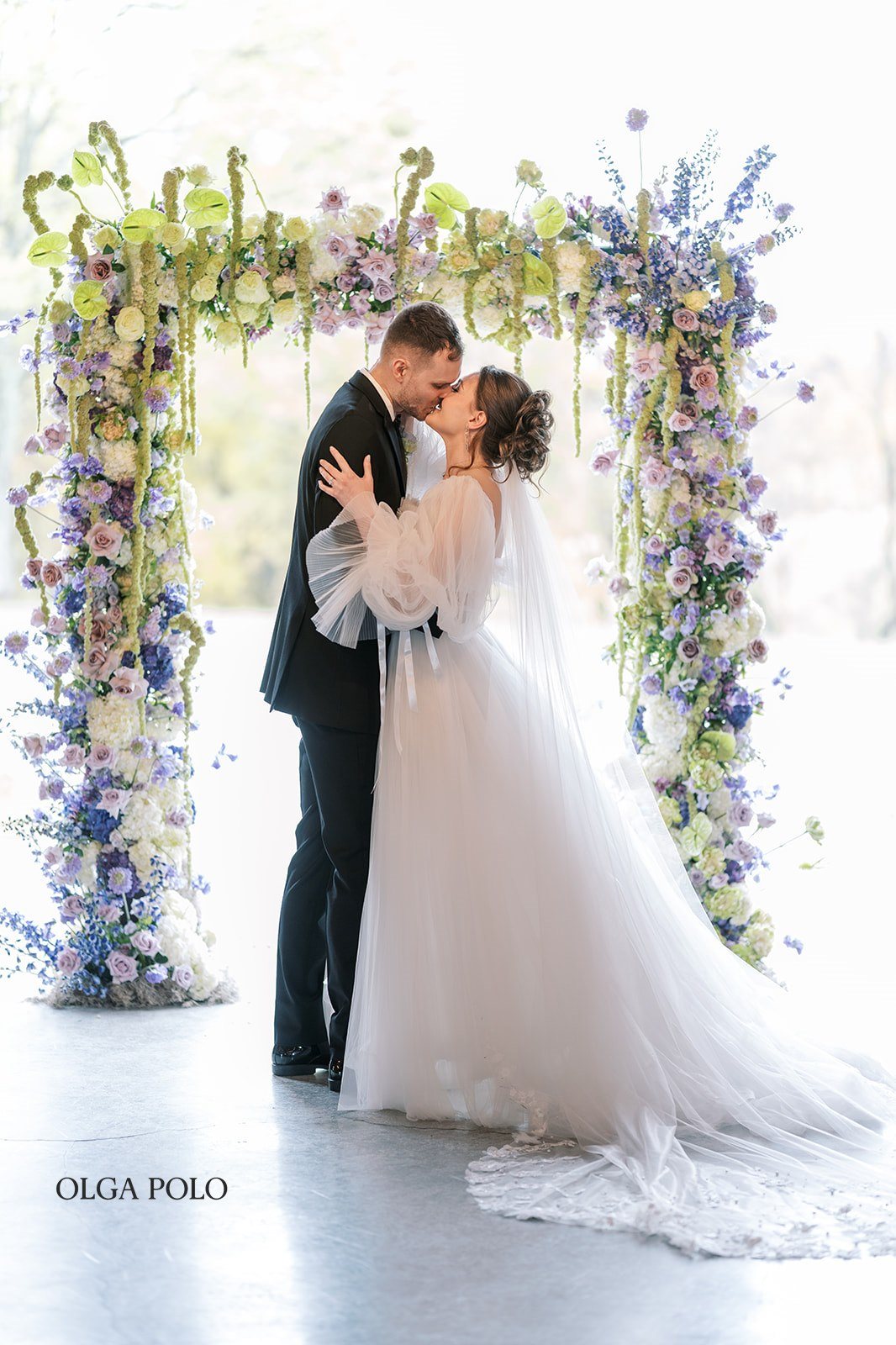 Maia and Troy kissing at the end of their wedding ceremony