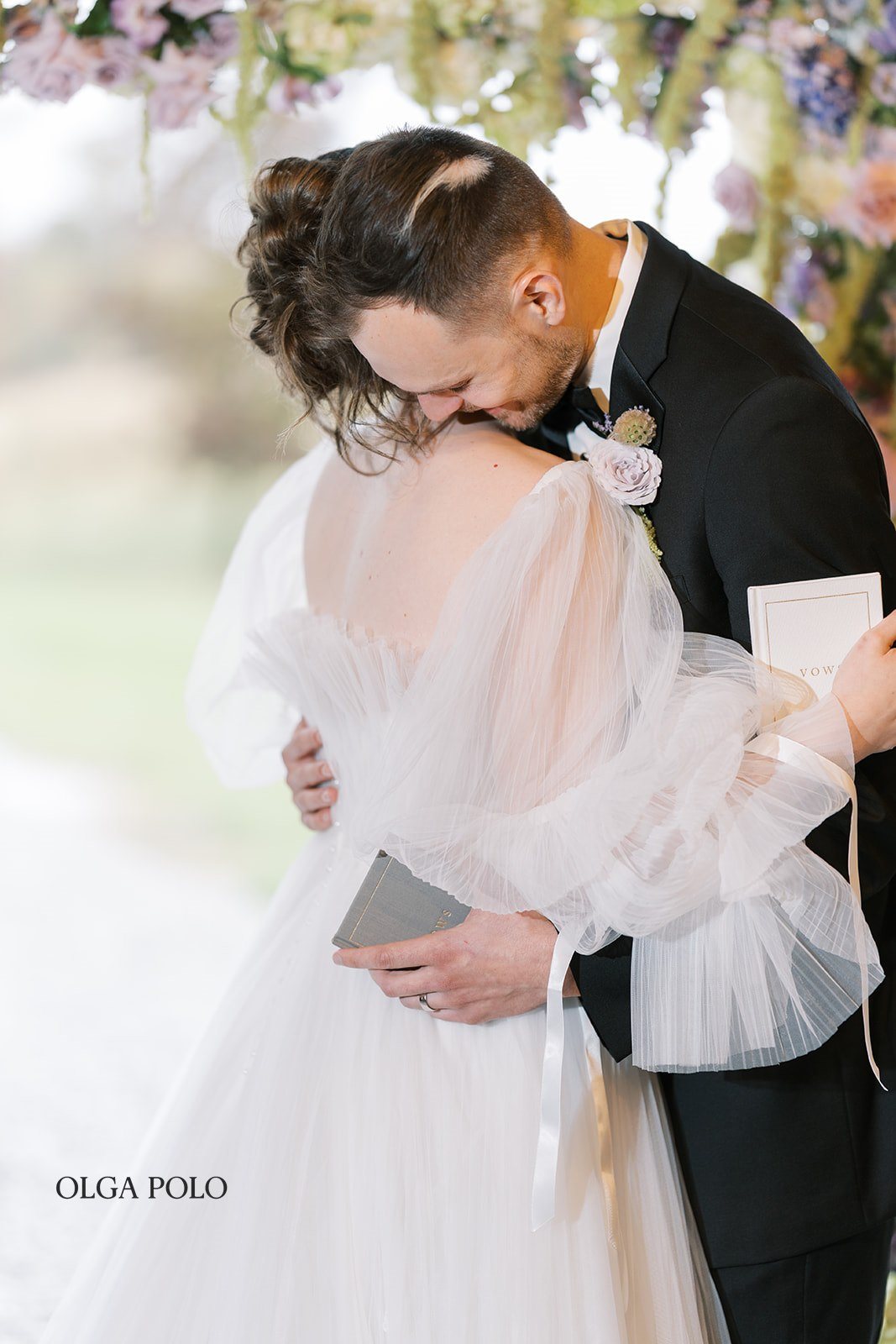 Maia and Troy embracing during their first look
