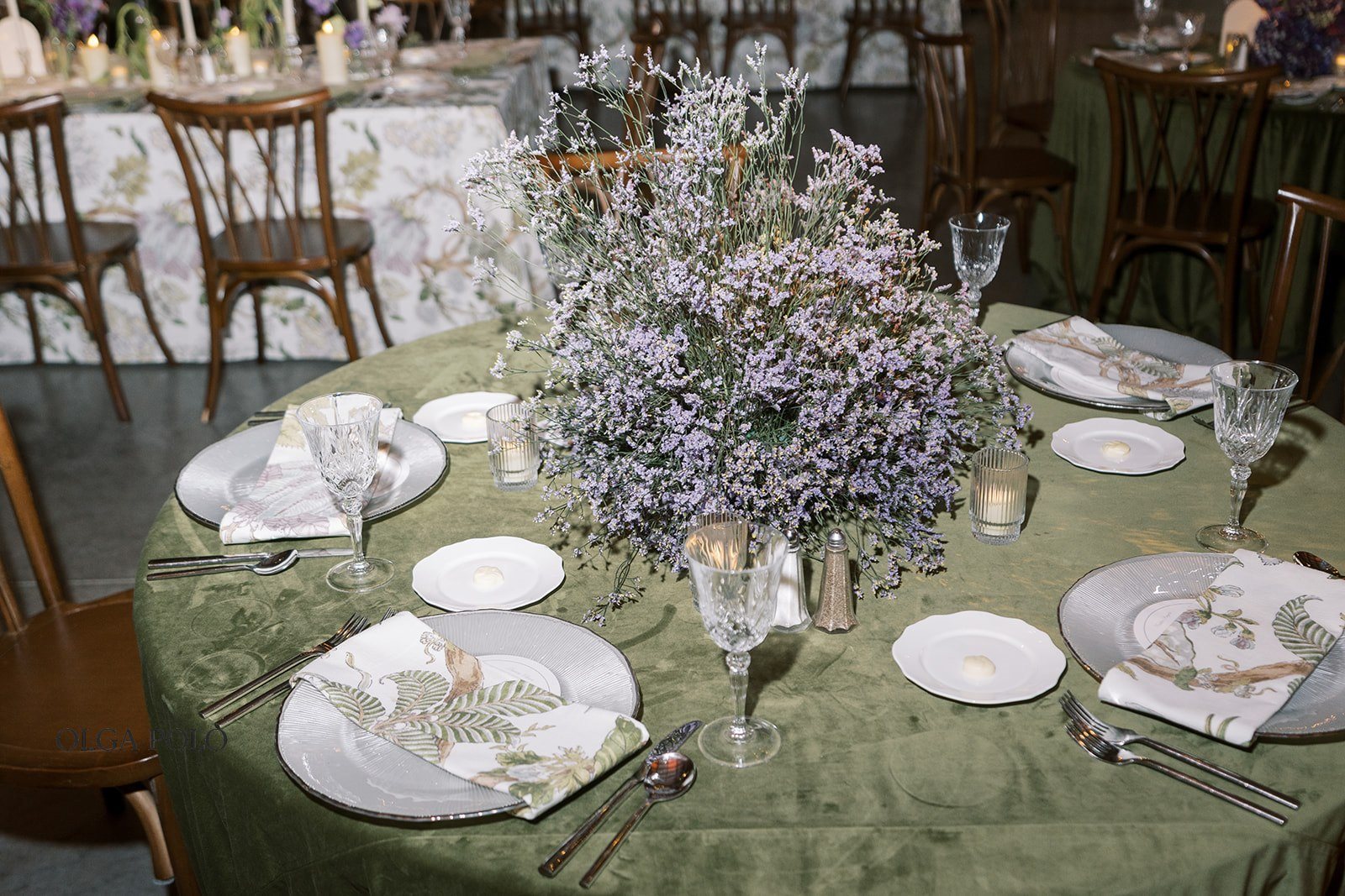Round reception table decorated for Maia and Troy's wedding