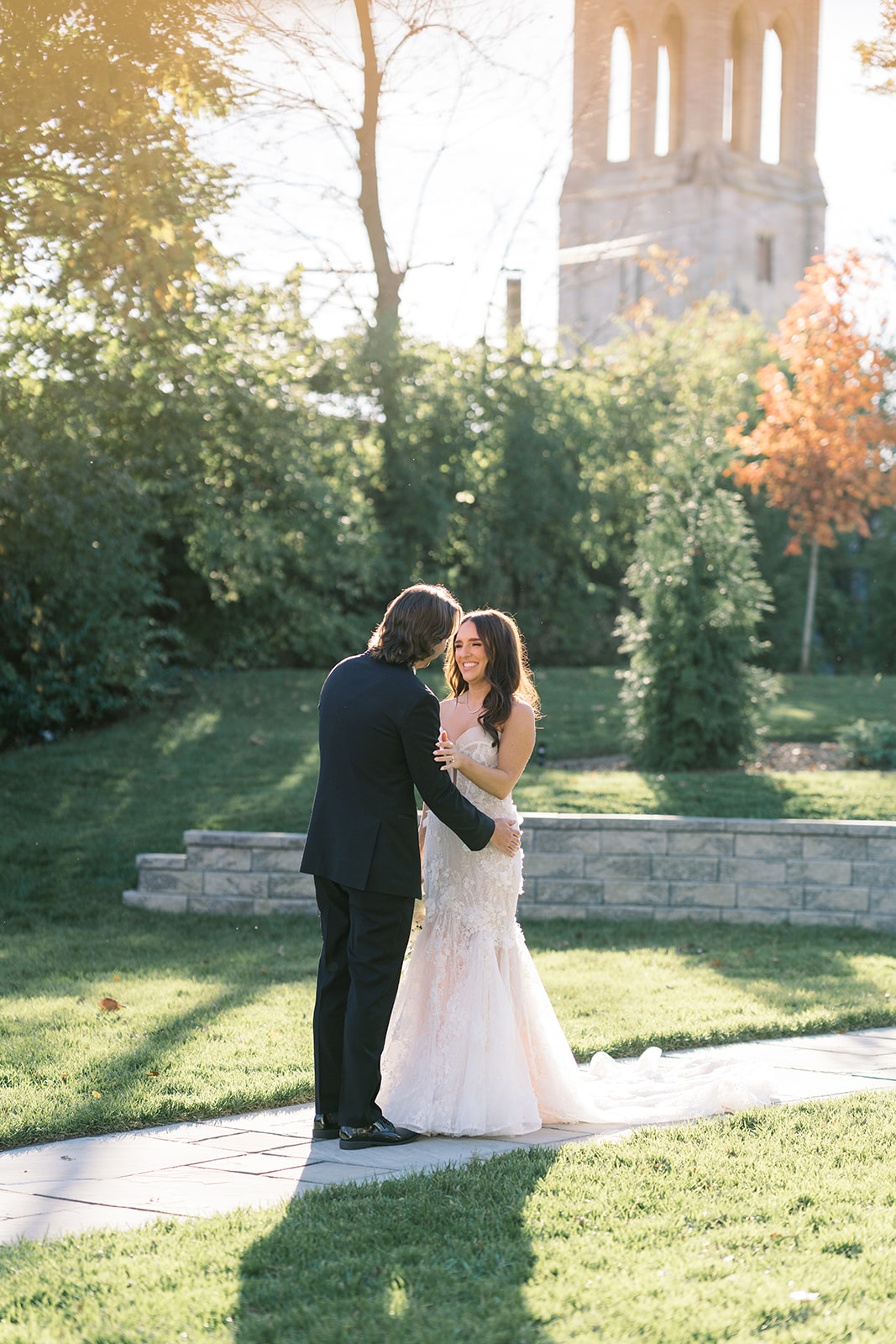 Ronnie and Patrick together outdoors with a Cincinnati church tower in the background