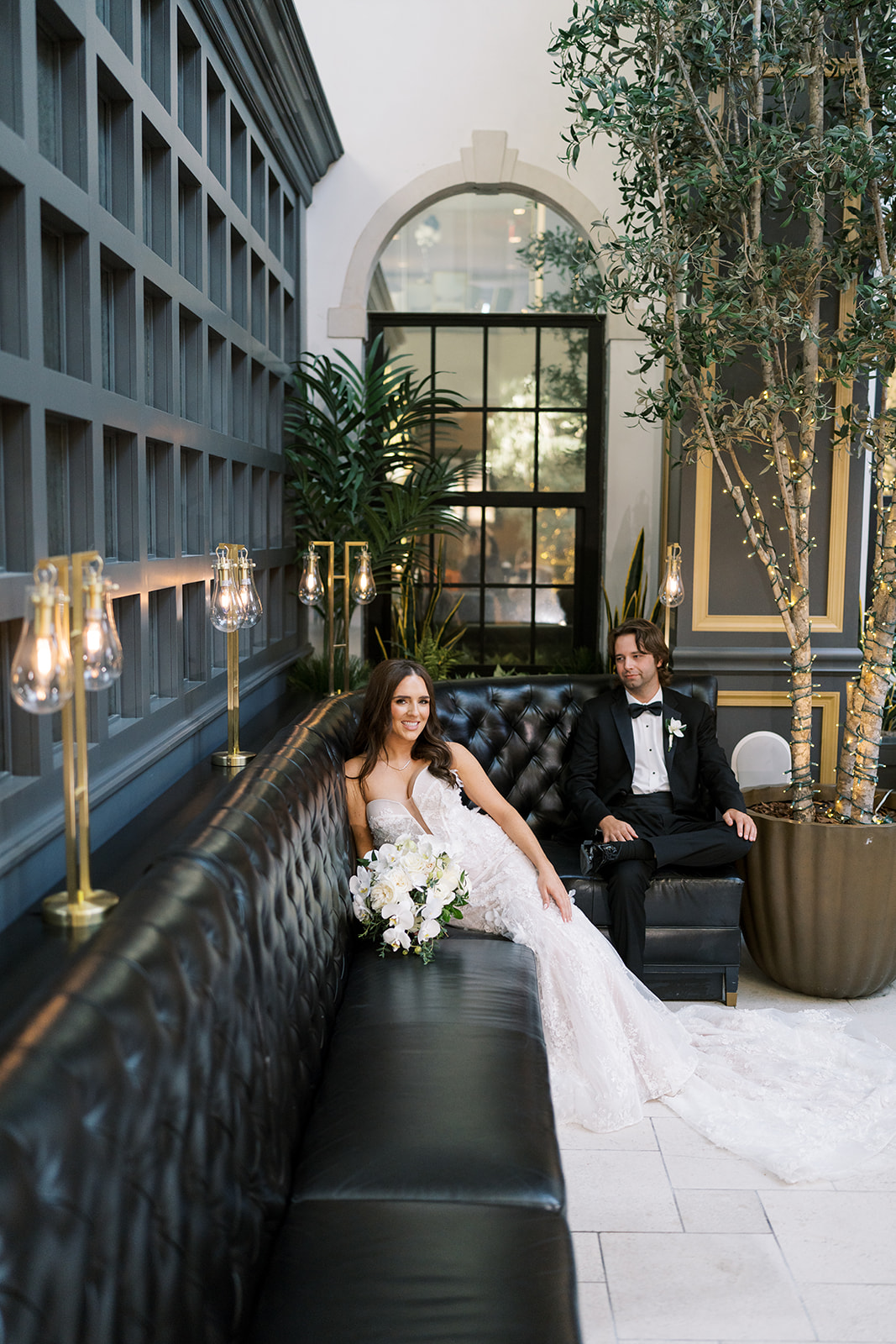 Ronnie and Patrick seated together for an outdoor city portrait