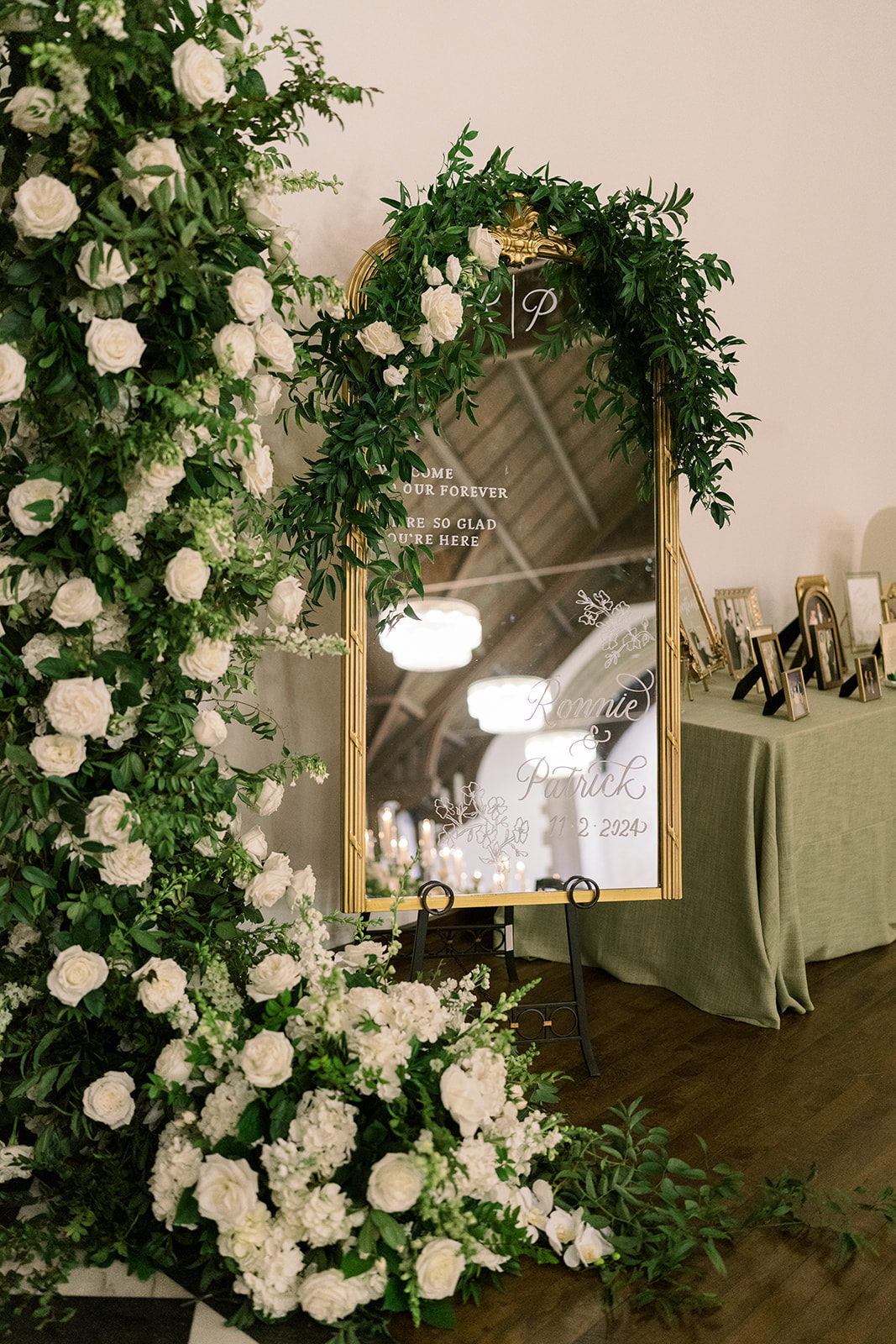 White floral installation arranged around a mirror at The Palomar Cincinnati