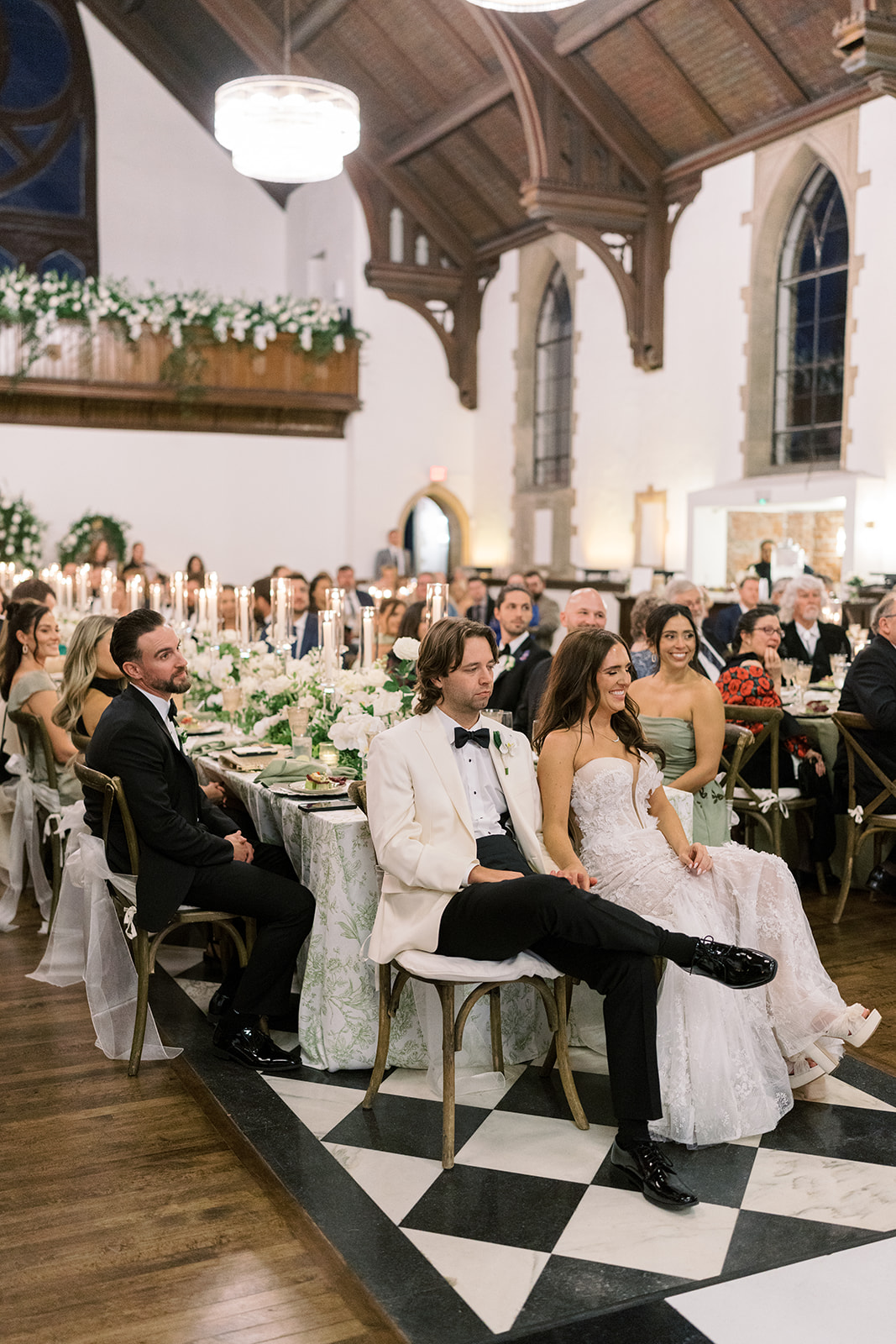 Wedding guests gathered at tables during Ronnie and Patrick's reception