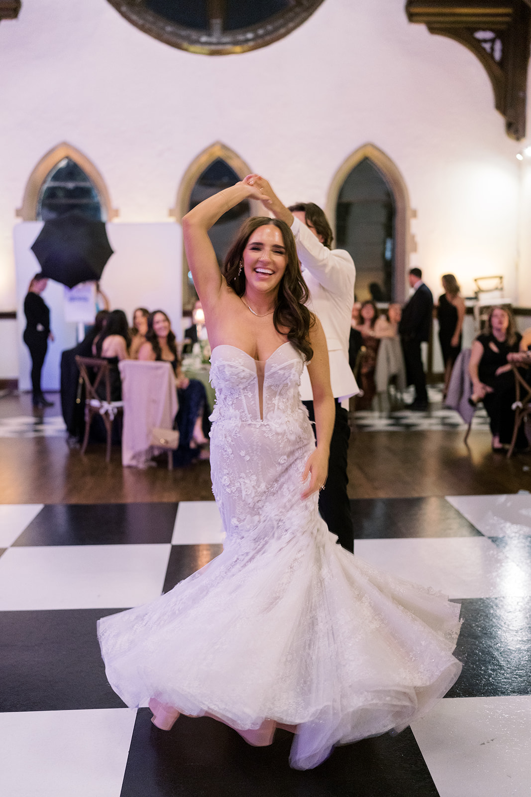 Ronnie dancing in her wedding gown during the evening reception
