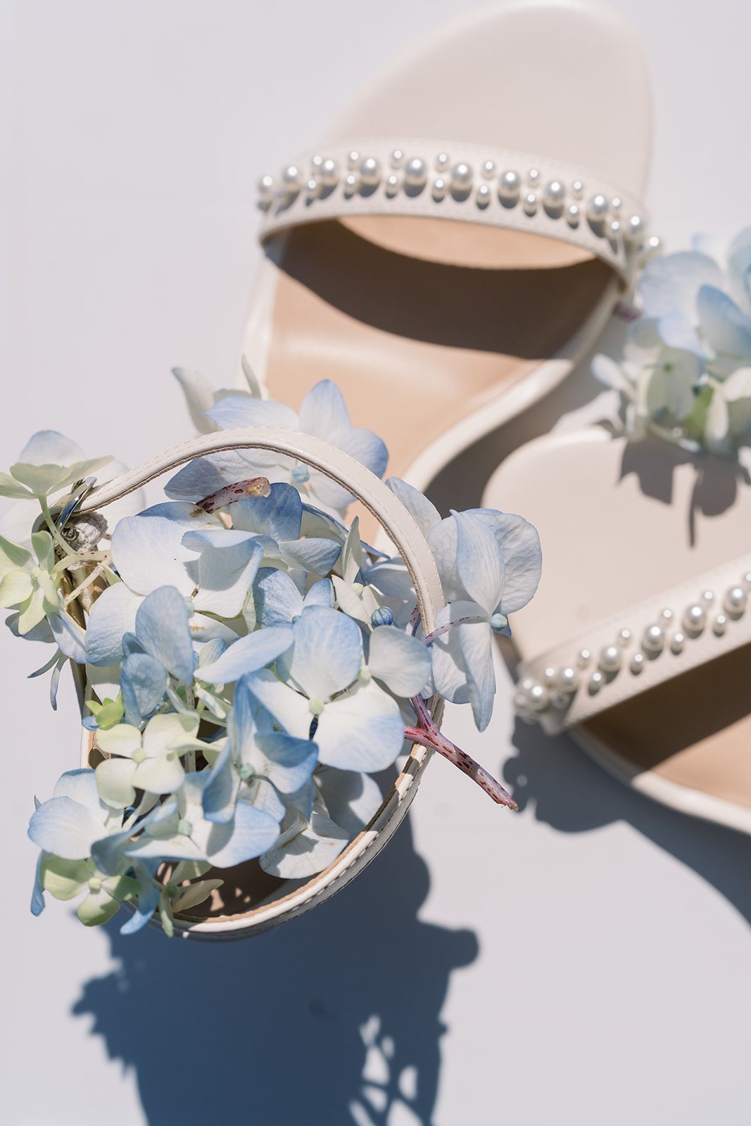 Andee & Quinn wedding at The Cincinnati Club: bridal shoes and hydrangea.