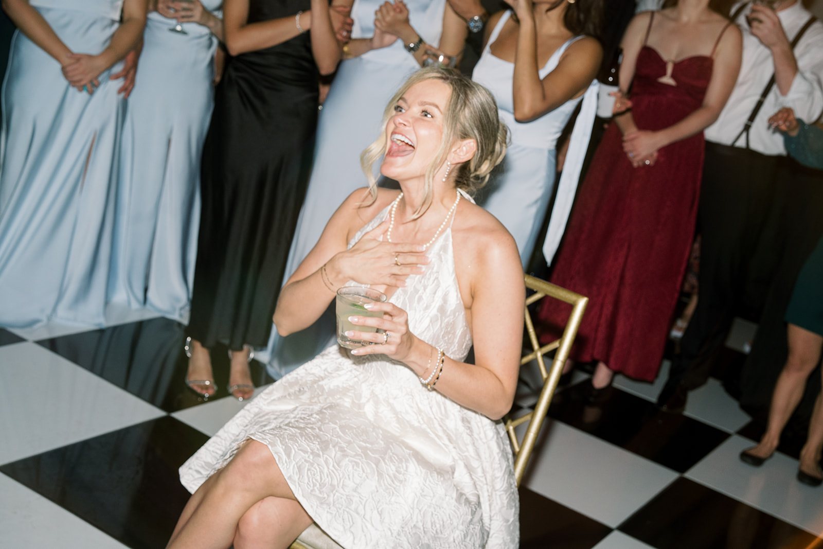 Andee & Quinn wedding at The Cincinnati Club: bride cheering on dance floor.