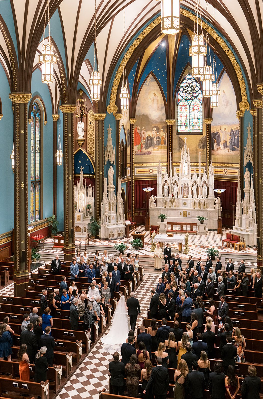Wide view of Andee and Quinn's wedding ceremony inside St. Francis Xavier Church