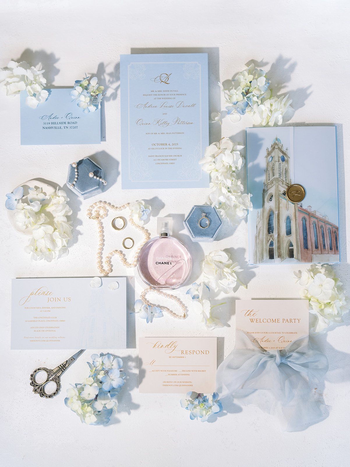 Blue-and-white wedding stationery, rings and floral details for Andee and Quinn