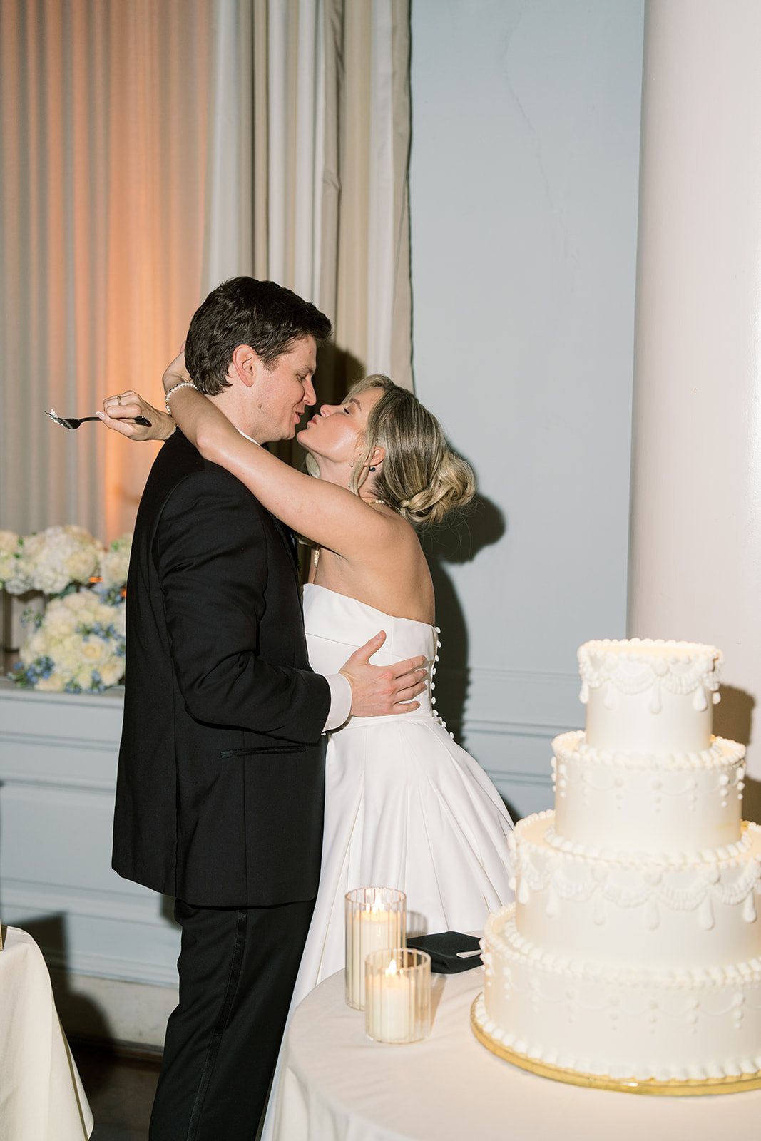 Andee & Quinn wedding at The Cincinnati Club: cake kiss.