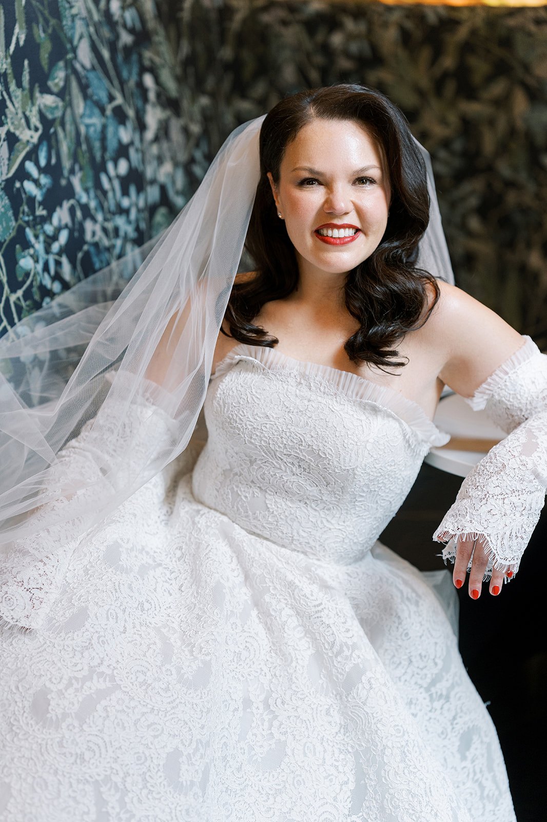Ania in her lace wedding gown and veil on her wedding day at Chicago Winery