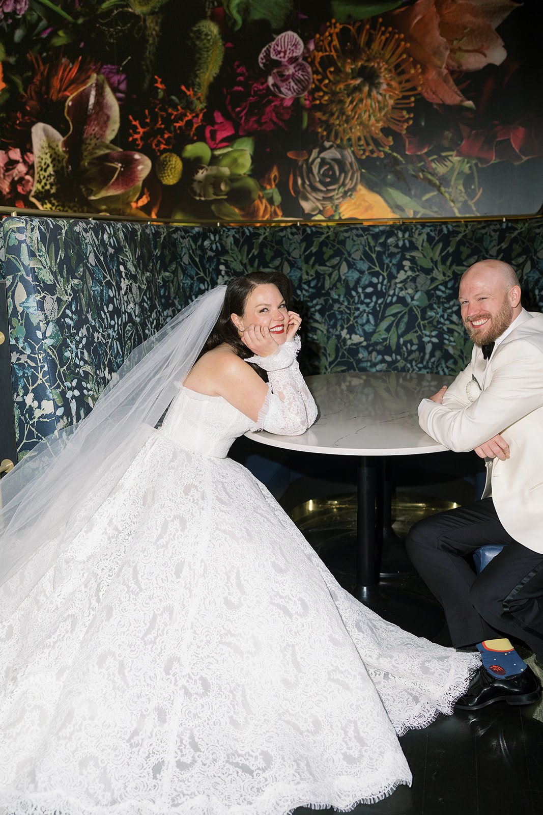 Clint and Ania wedding: clint ania floral wall seated two.