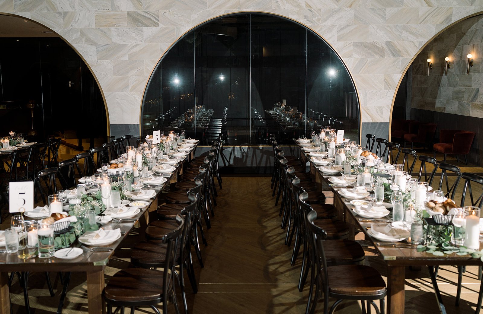 Long dinner table set for Ania and Clint's reception at Chicago Winery