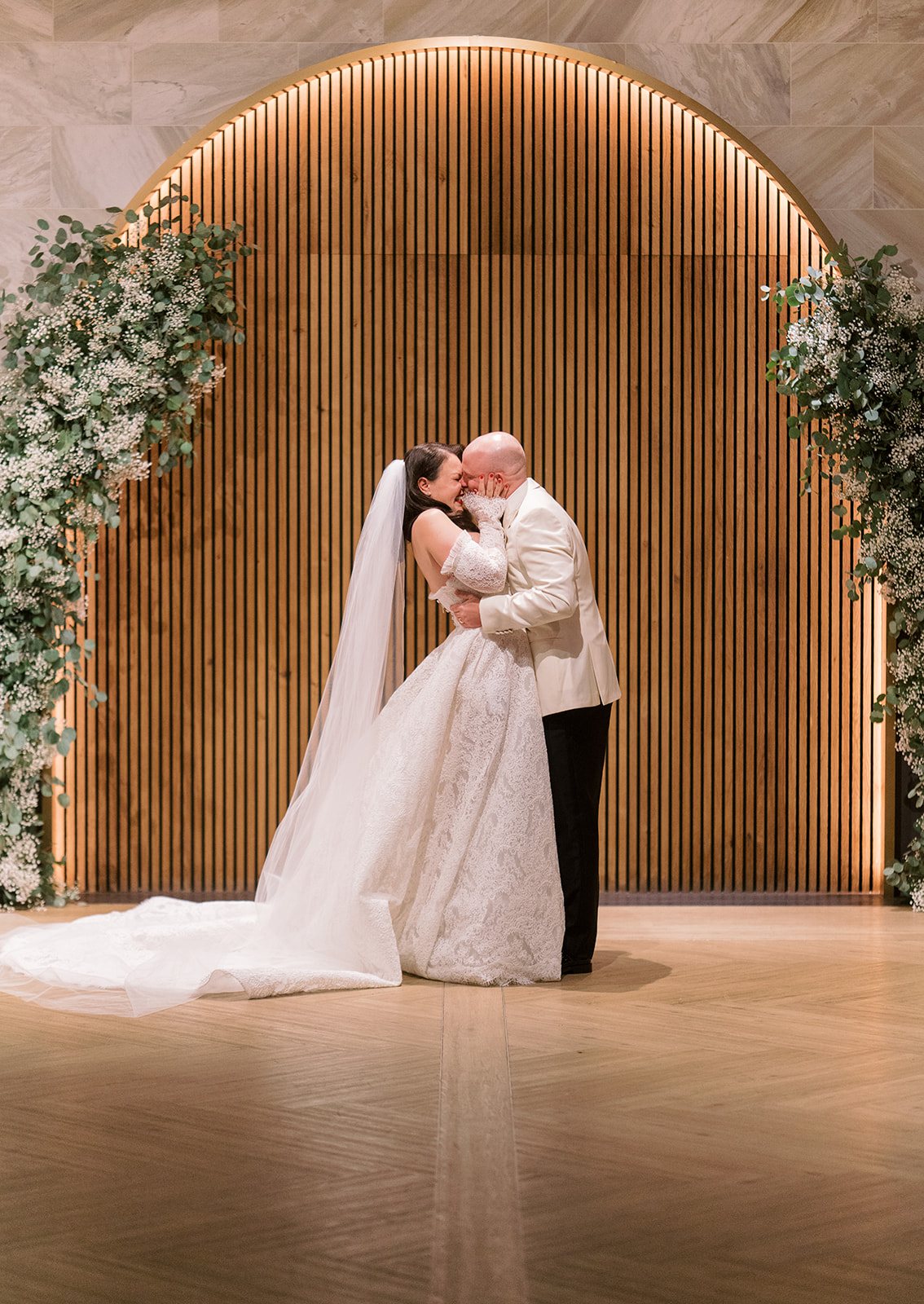 Clint and Ania kissing during their wedding ceremony at Chicago Winery