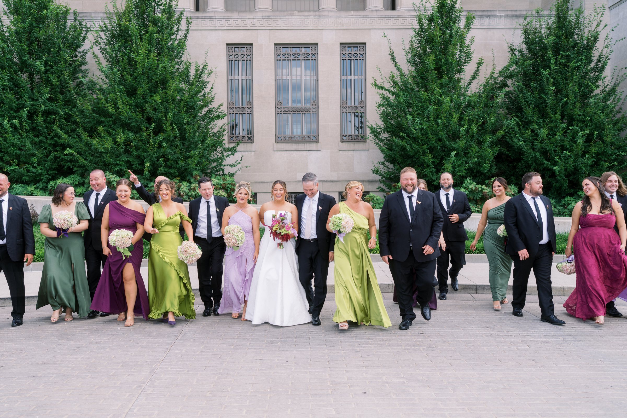 Kent and Nicolette wedding: wedding party walking outdoors.