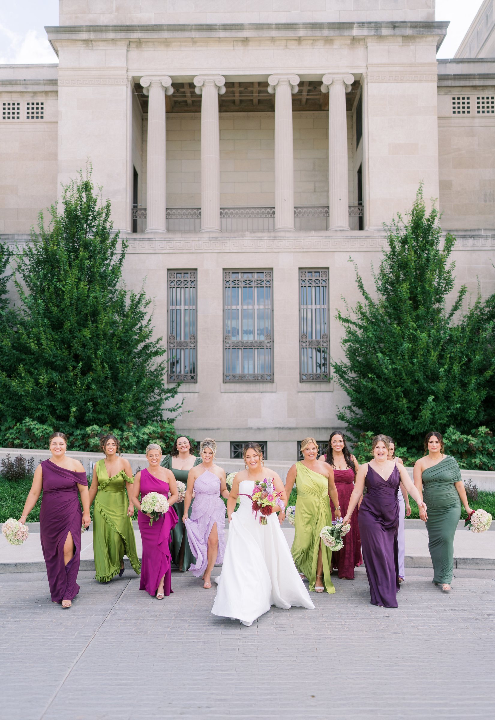 Kent and Nicolette wedding: wedding party classical building wide.