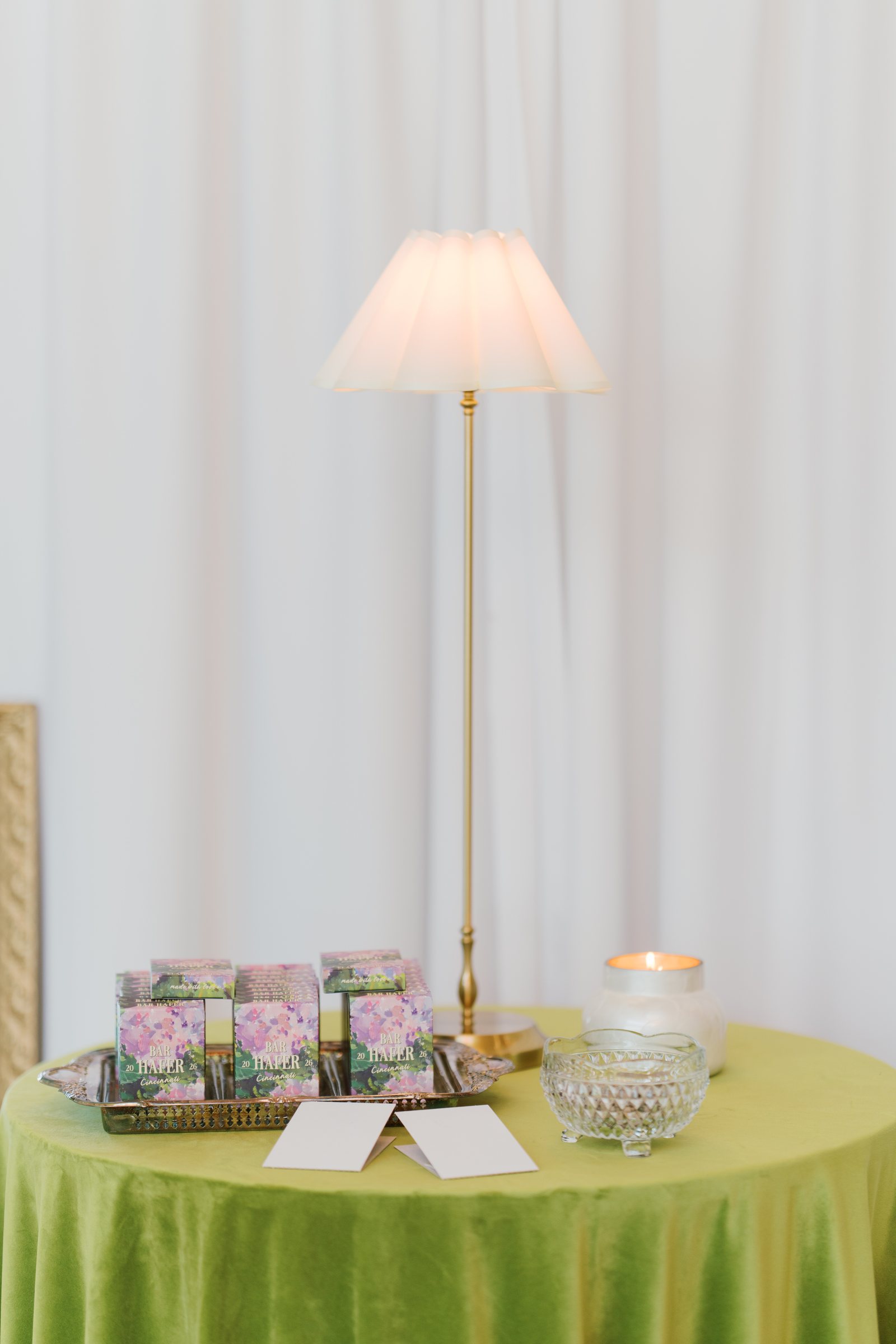 Kent and Nicolette wedding: reception card table green linen.