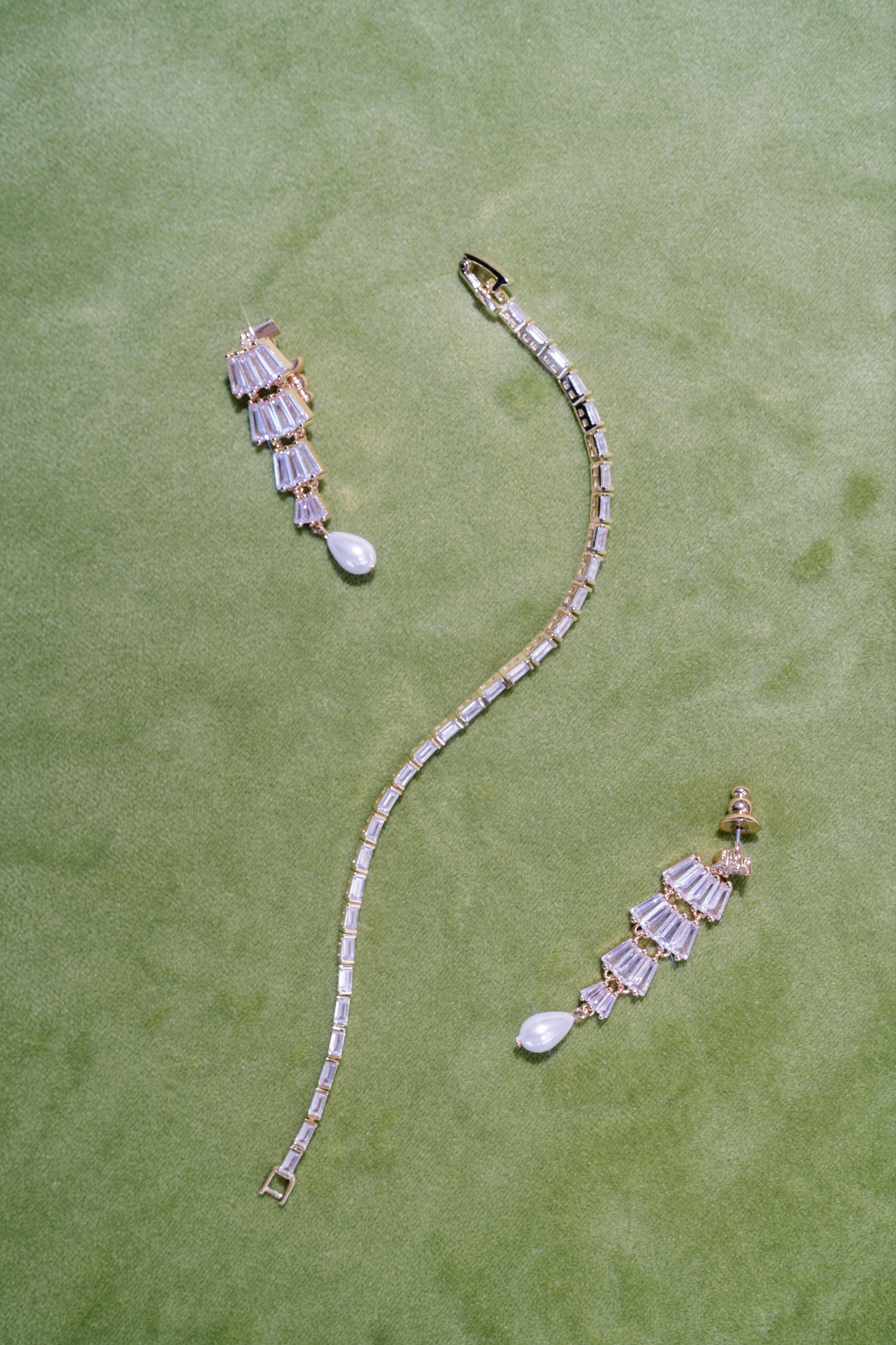 Kent and Nicolette wedding: bridal jewelry green detail.