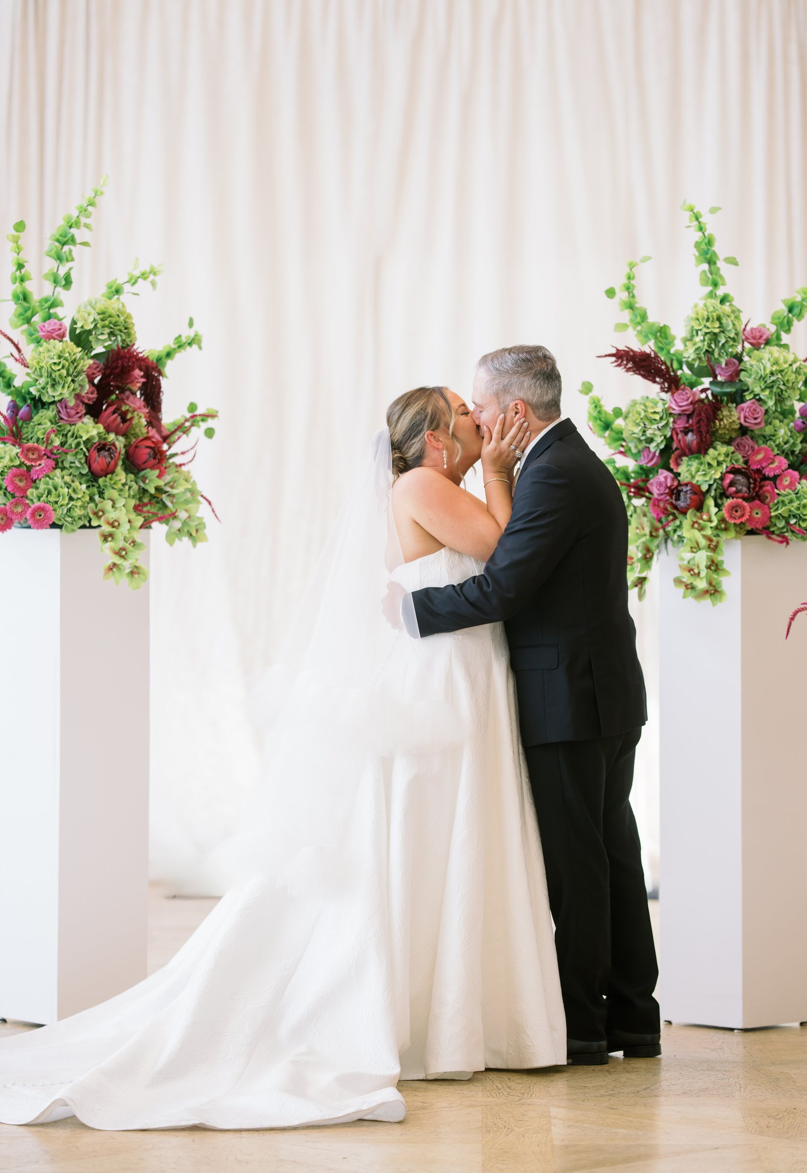 Kent and Nicolette kissing during their wedding ceremony at The View at Mt. Adams