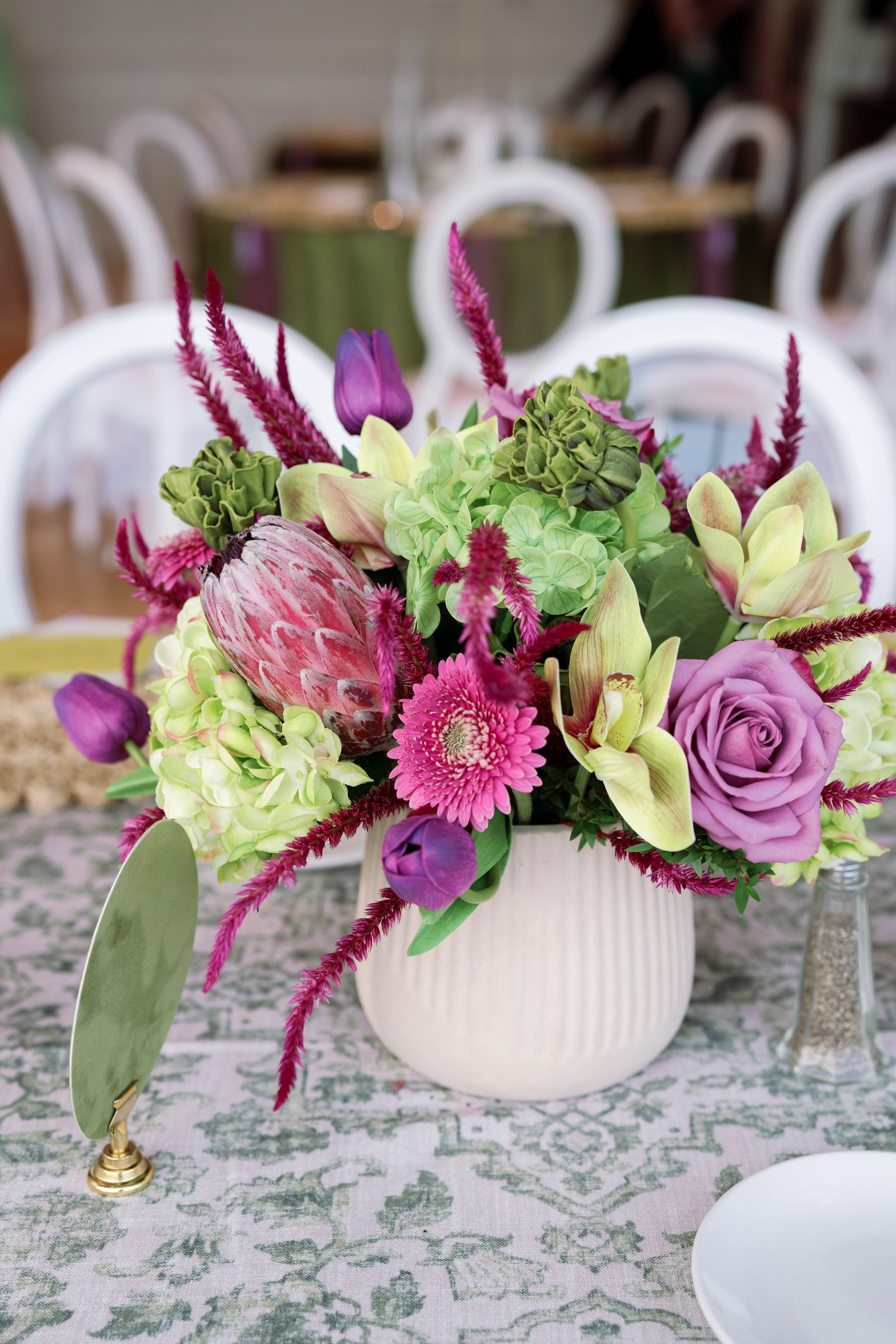 Kent and Nicolette wedding: colorful reception floral centerpiece.