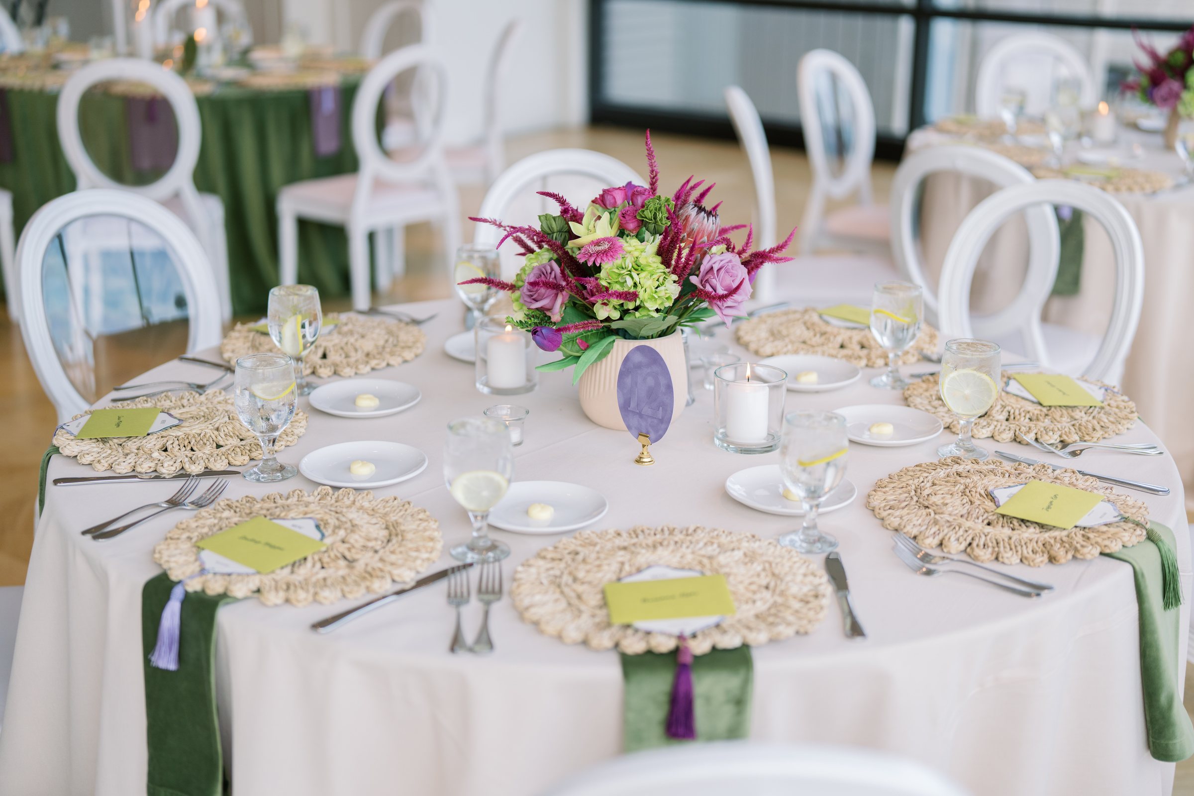 Kent and Nicolette wedding: round reception table colorful flowers.