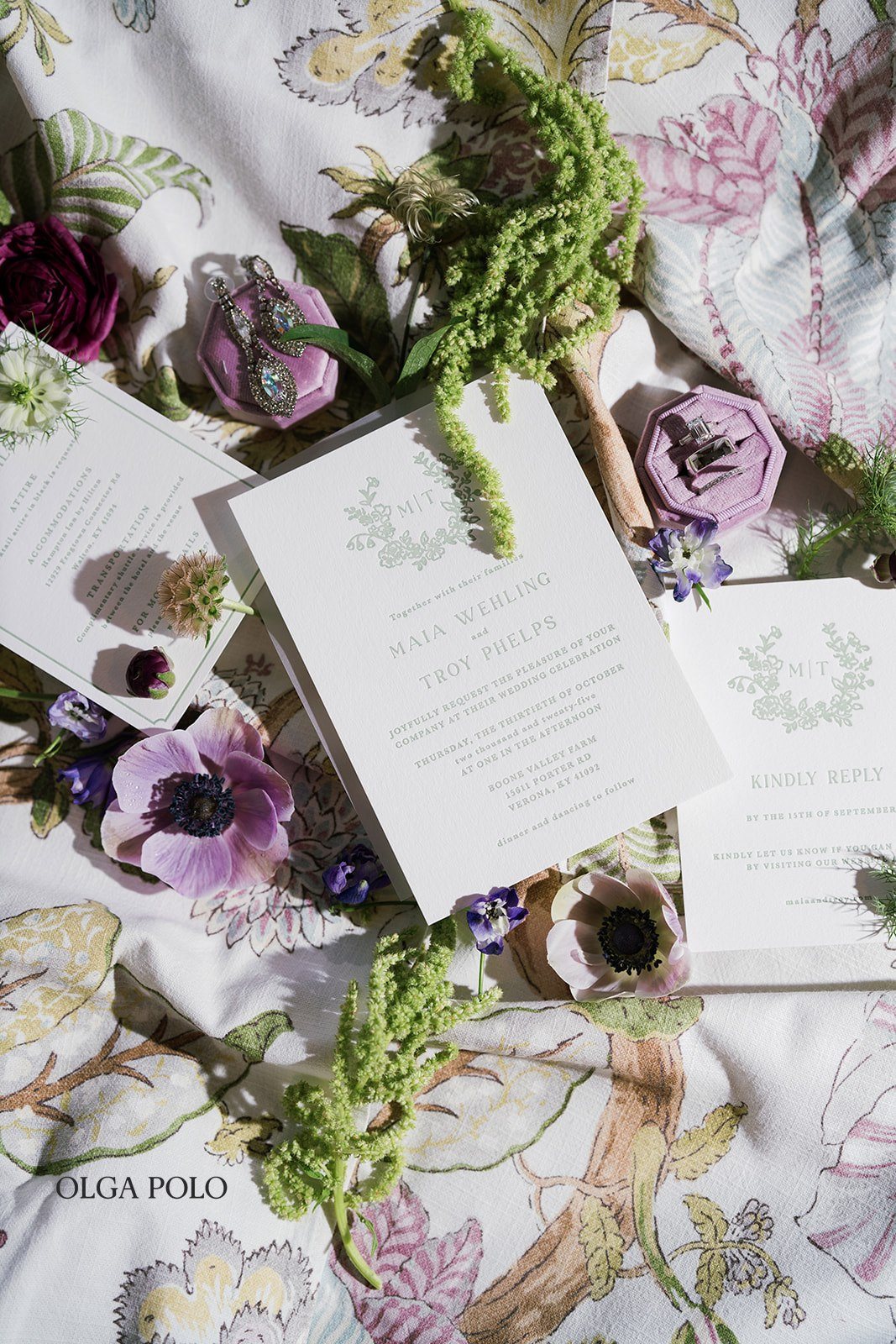 Maia and Troy's invitation suite styled with purple and green wedding details