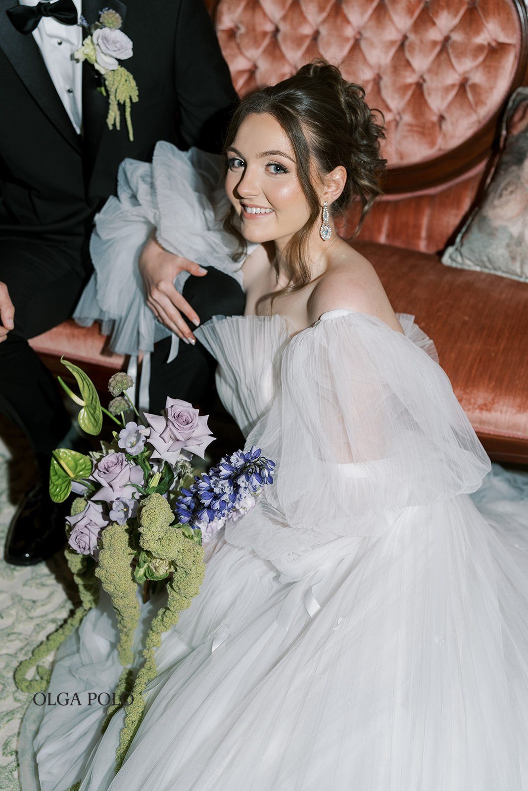 Maia and Troy seated together for a wedding-day portrait