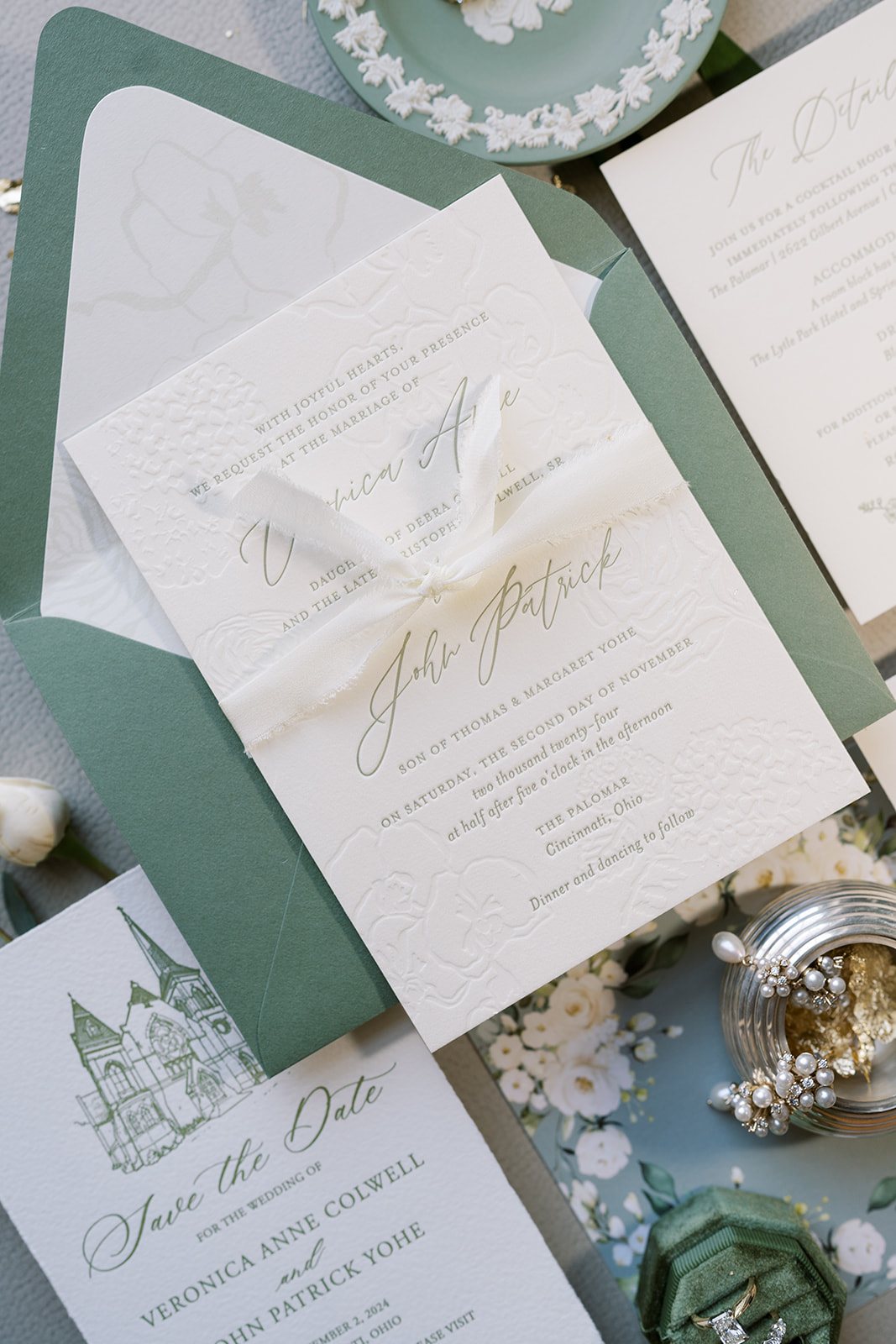 Green-and-white invitation suite, rings and wedding details for Ronnie and Patrick