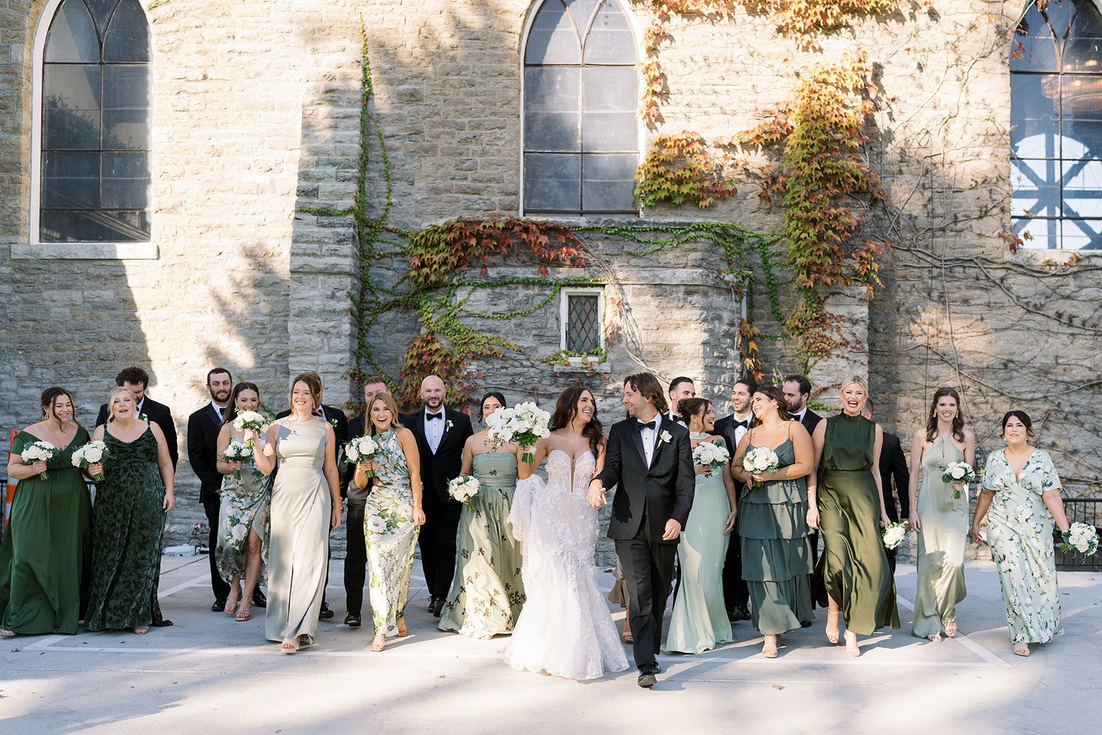 Ronnie and Patrick with their wedding party outside The Palomar Cincinnati