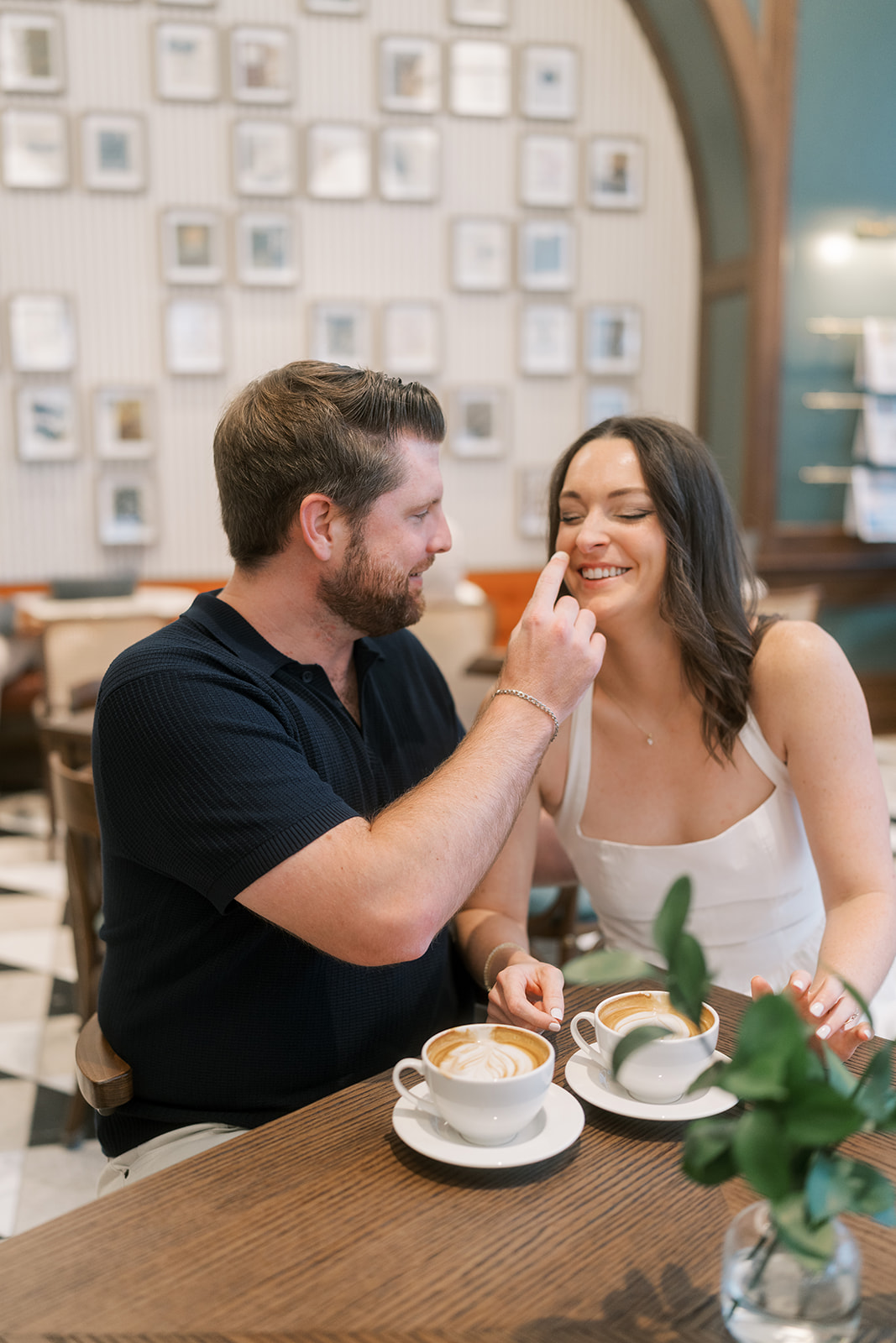 Frank and Noelle laughing together over coffee