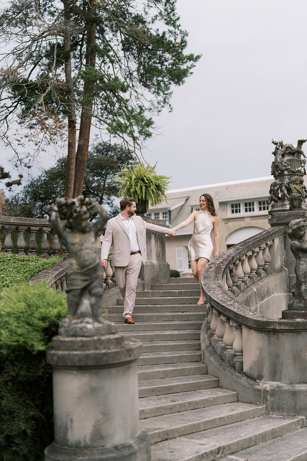 Frank and Noelle on the curved exterior stairs at Laurel Court