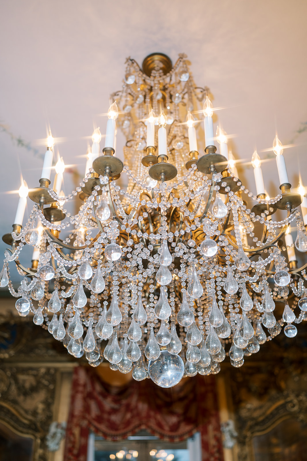 Crystal chandelier glowing inside Laurel Court