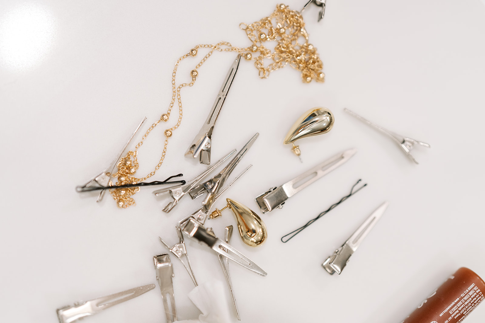 Close detail of hair accessories arranged during Autumn's preparation
