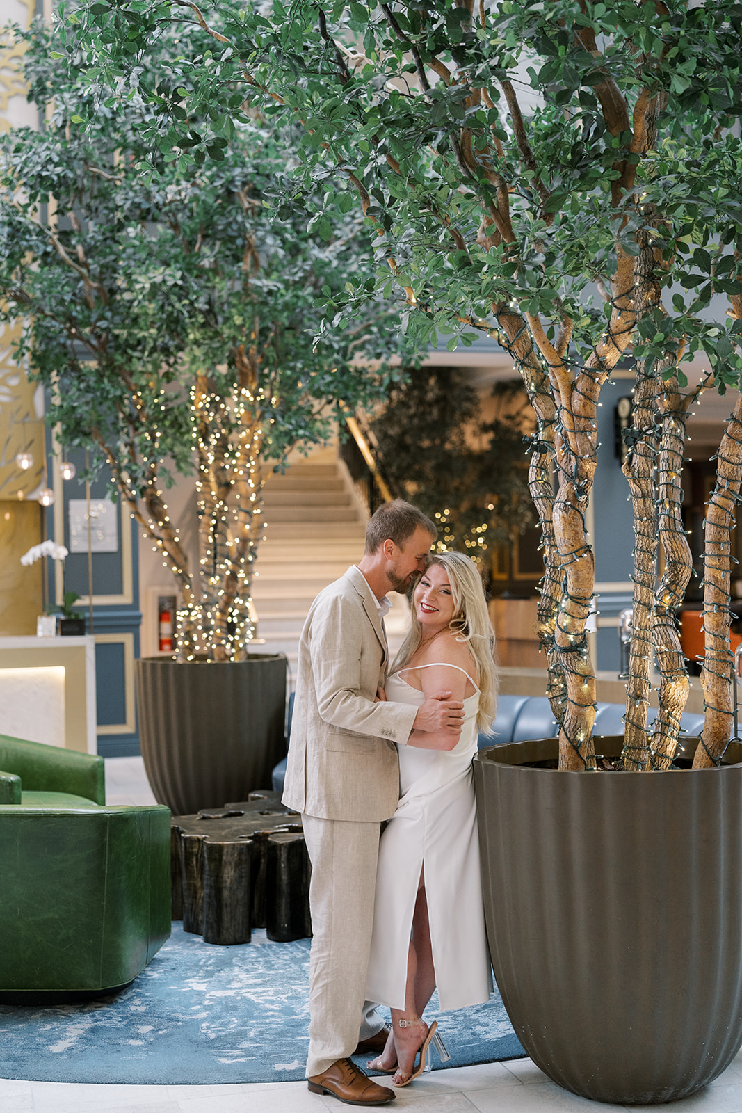 Josh and Autumn posing together in the hotel courtyard