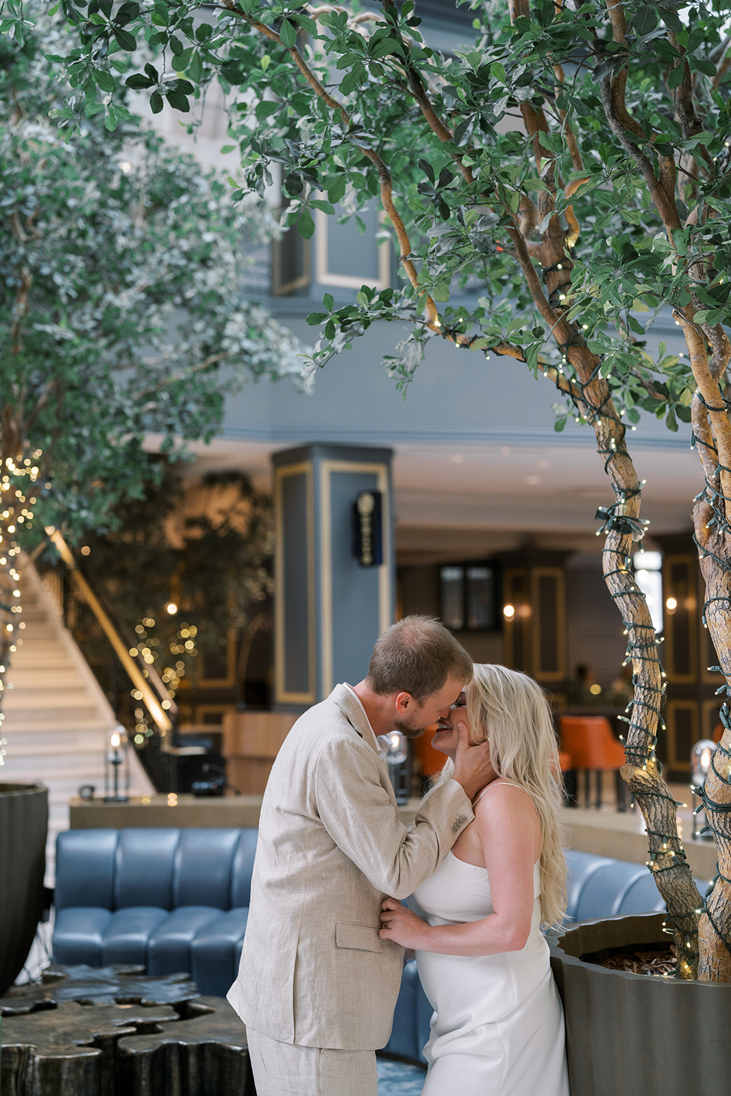 Josh and Autumn together near the courtyard greenery at The Lytle Park Hotel