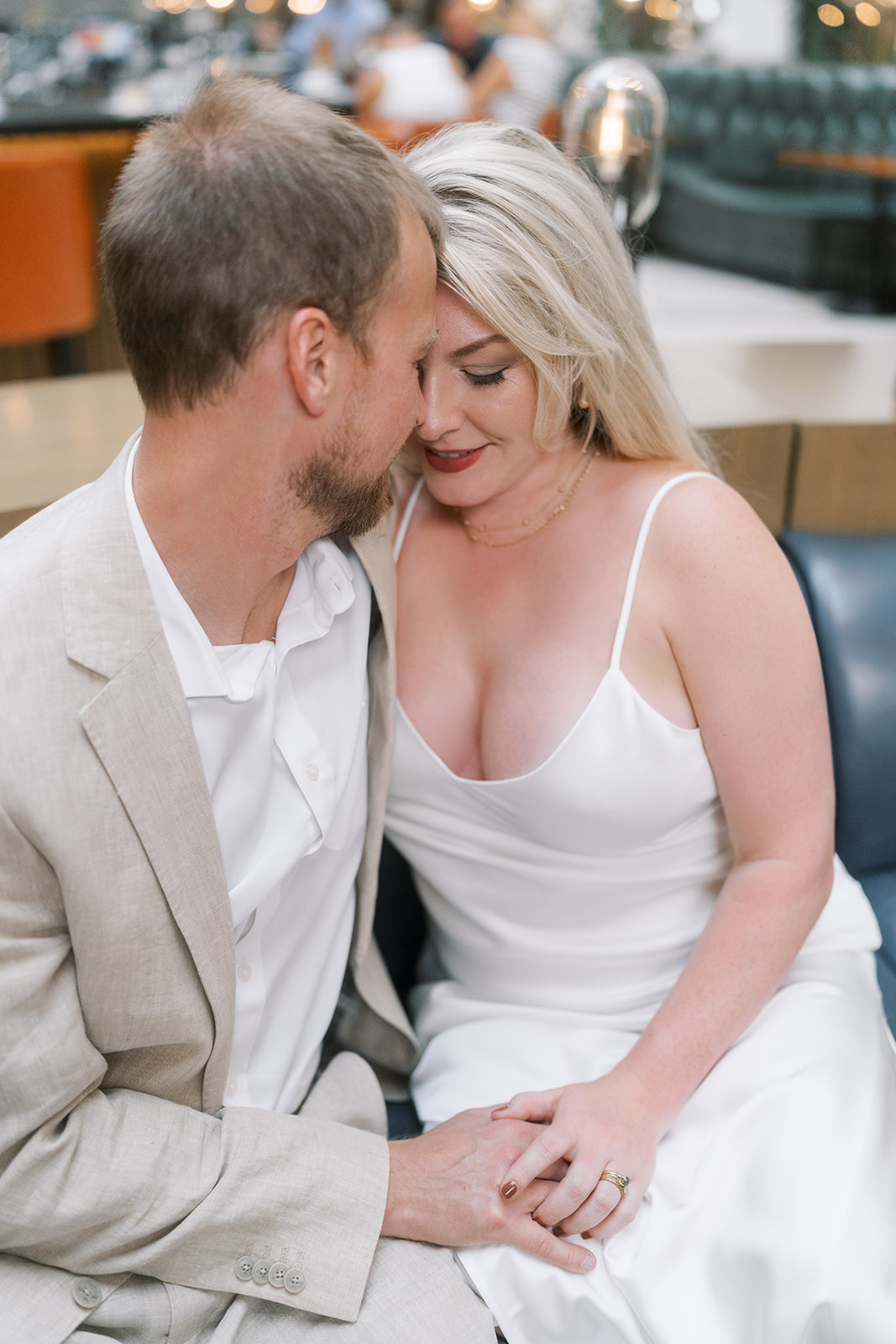 Close seated portrait of Josh and Autumn in the Lytle Park Hotel lobby