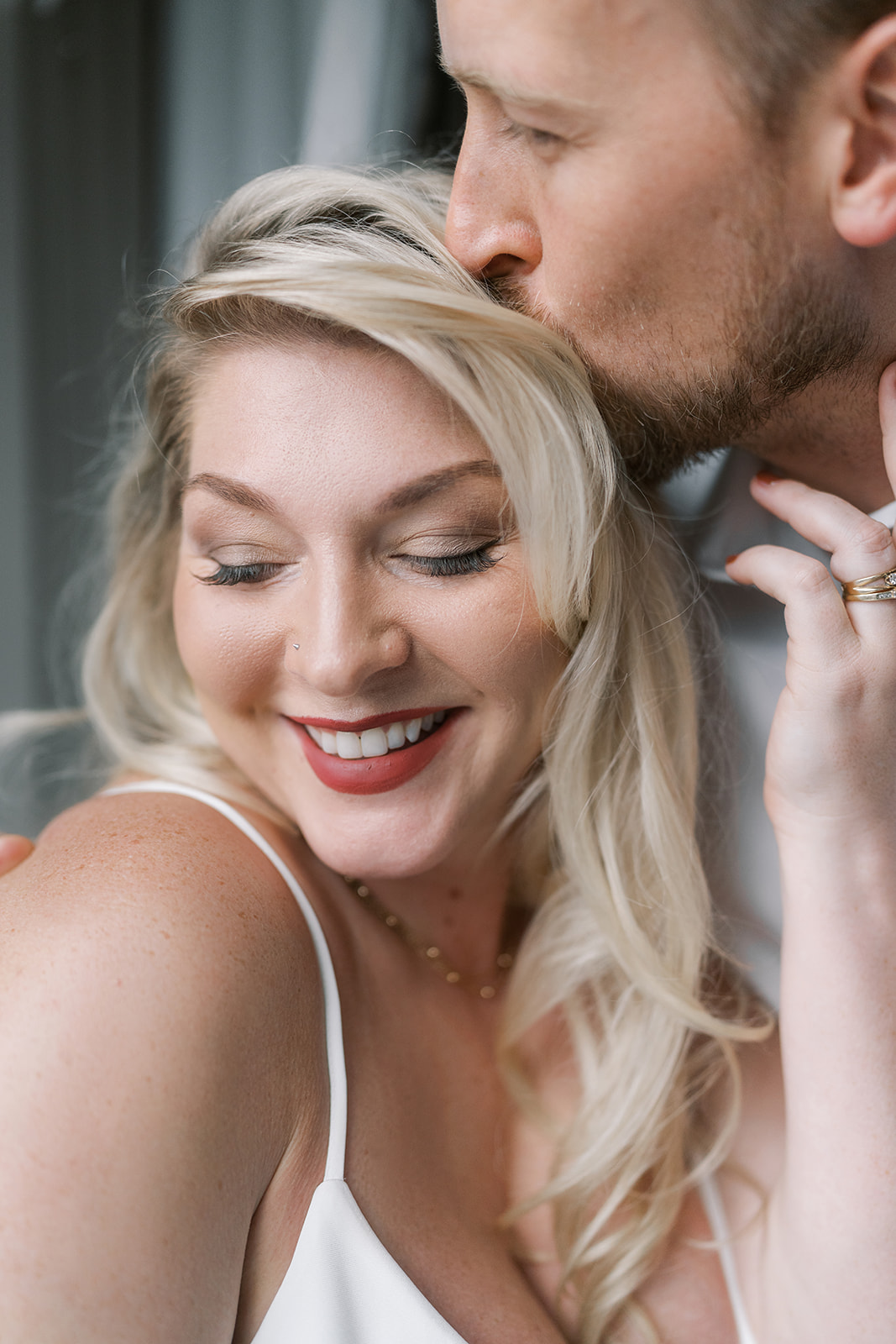 Close portrait of Josh and Autumn together inside the hotel