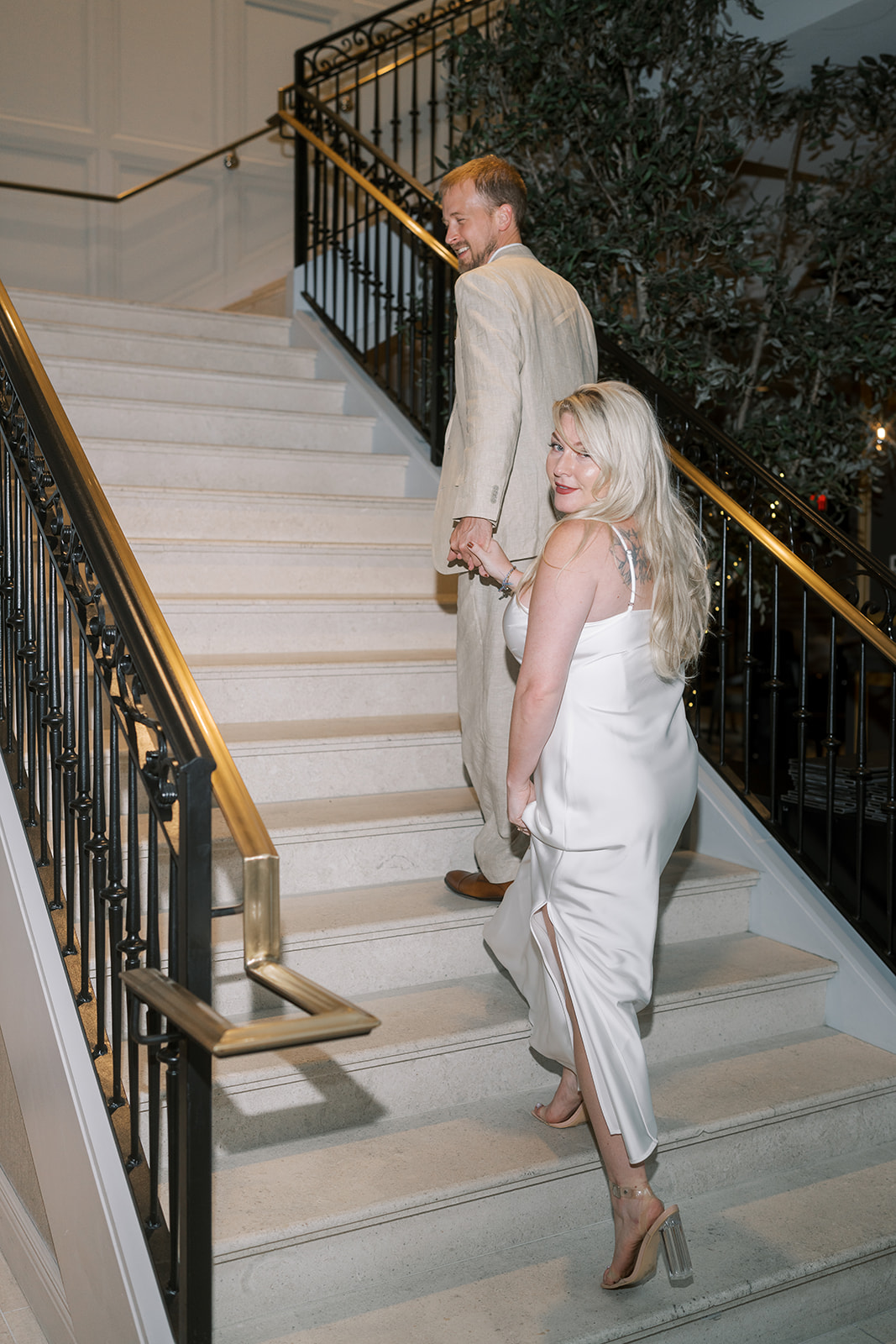 Josh and Autumn moving together on the hotel staircase