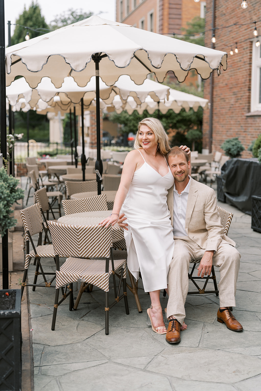 Josh and Autumn seated together on the outdoor terrace