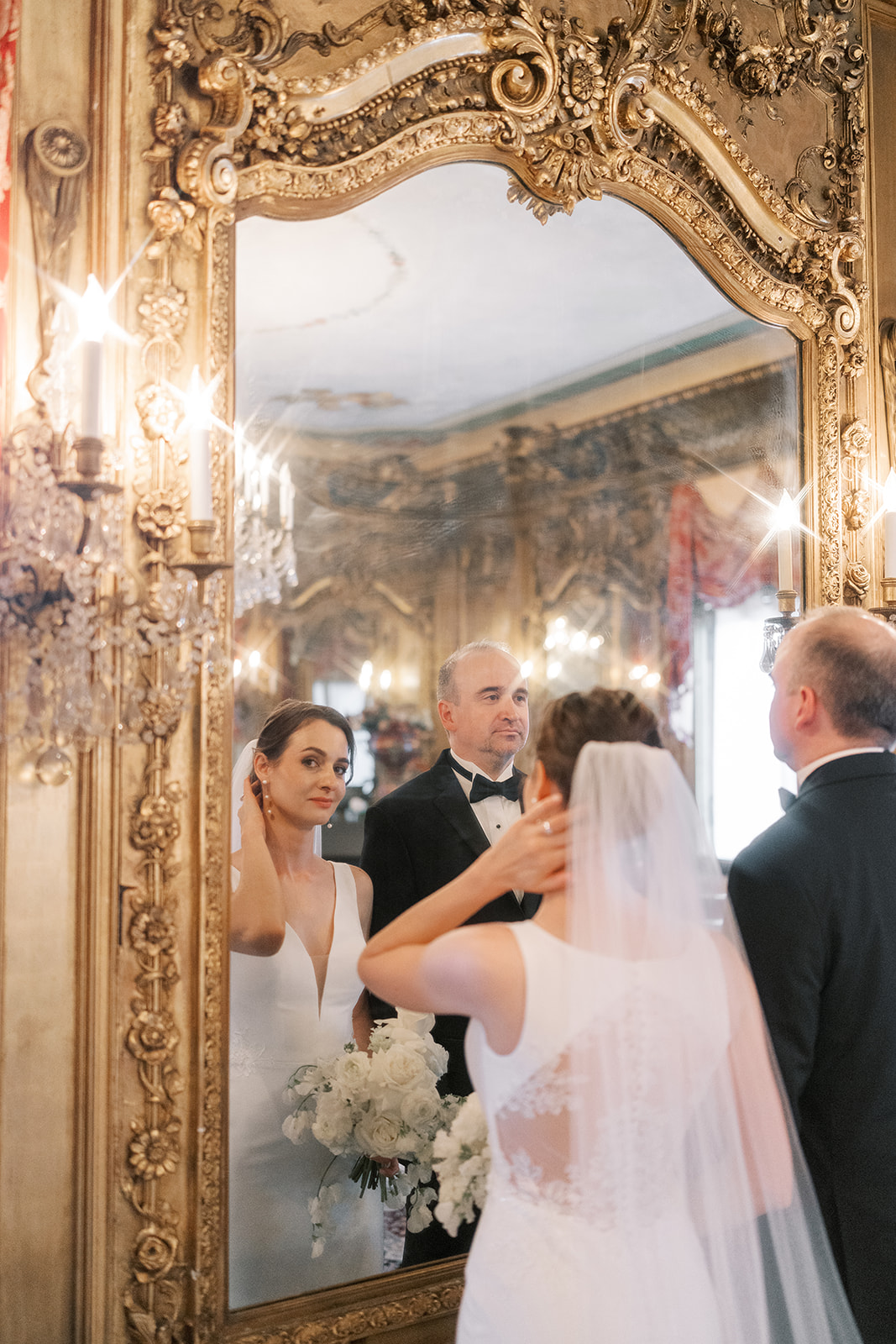 Julia reflected in an ornate mirror inside Laurel Court