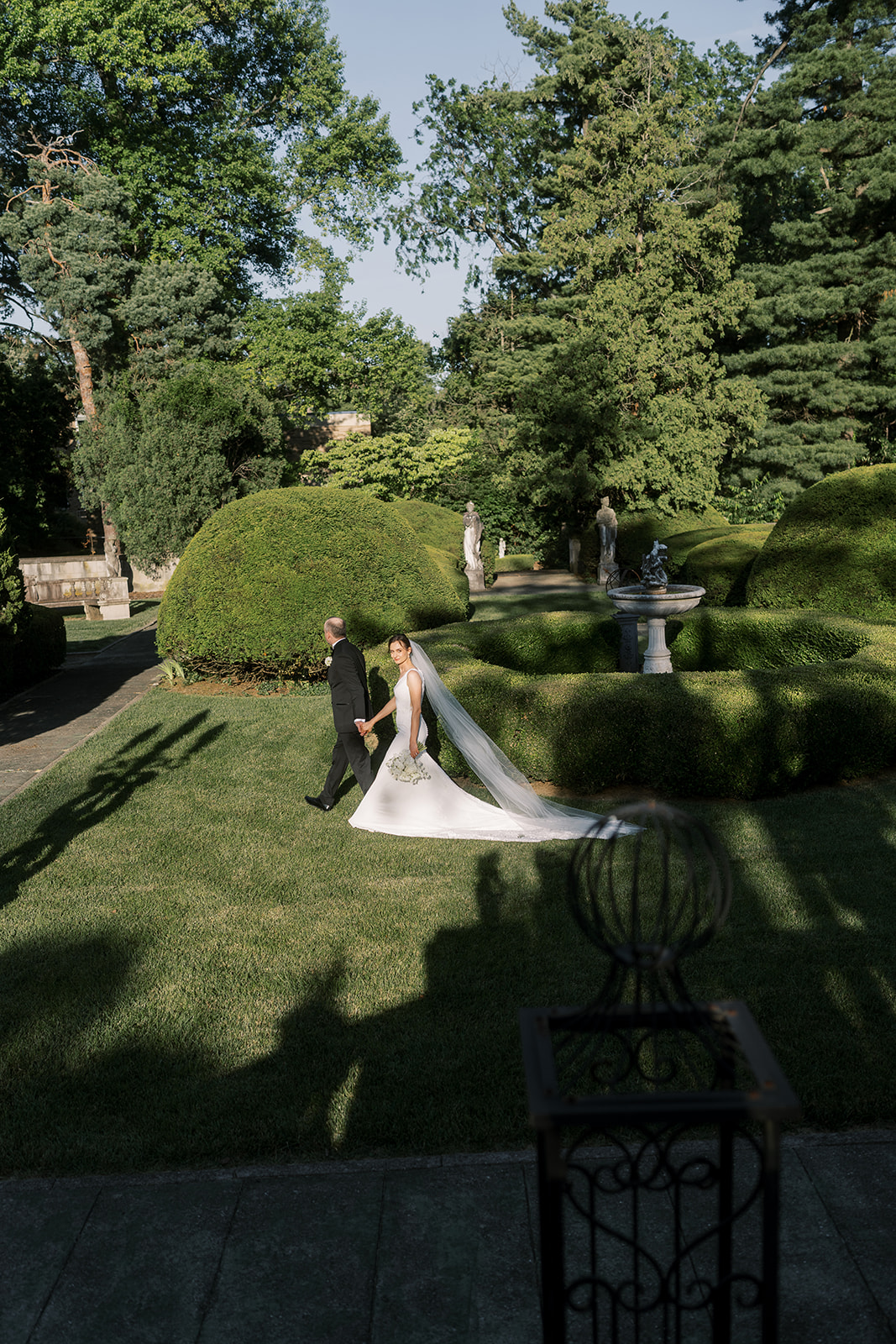 Michael and Julia photographed from above in the formal garden at Laurel Court