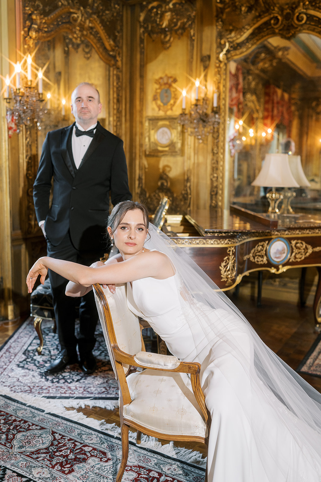 Michael and Julia posed together in the ornate gilded room at Laurel Court