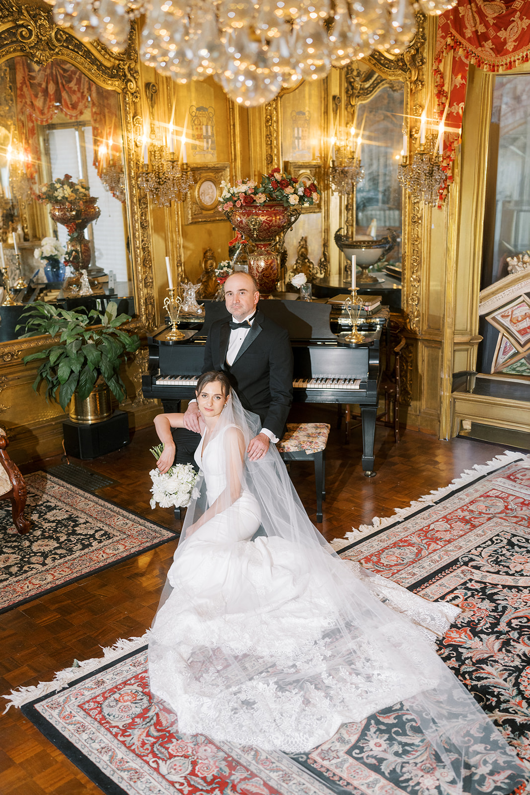 Michael and Julia seated together beside the piano at Laurel Court