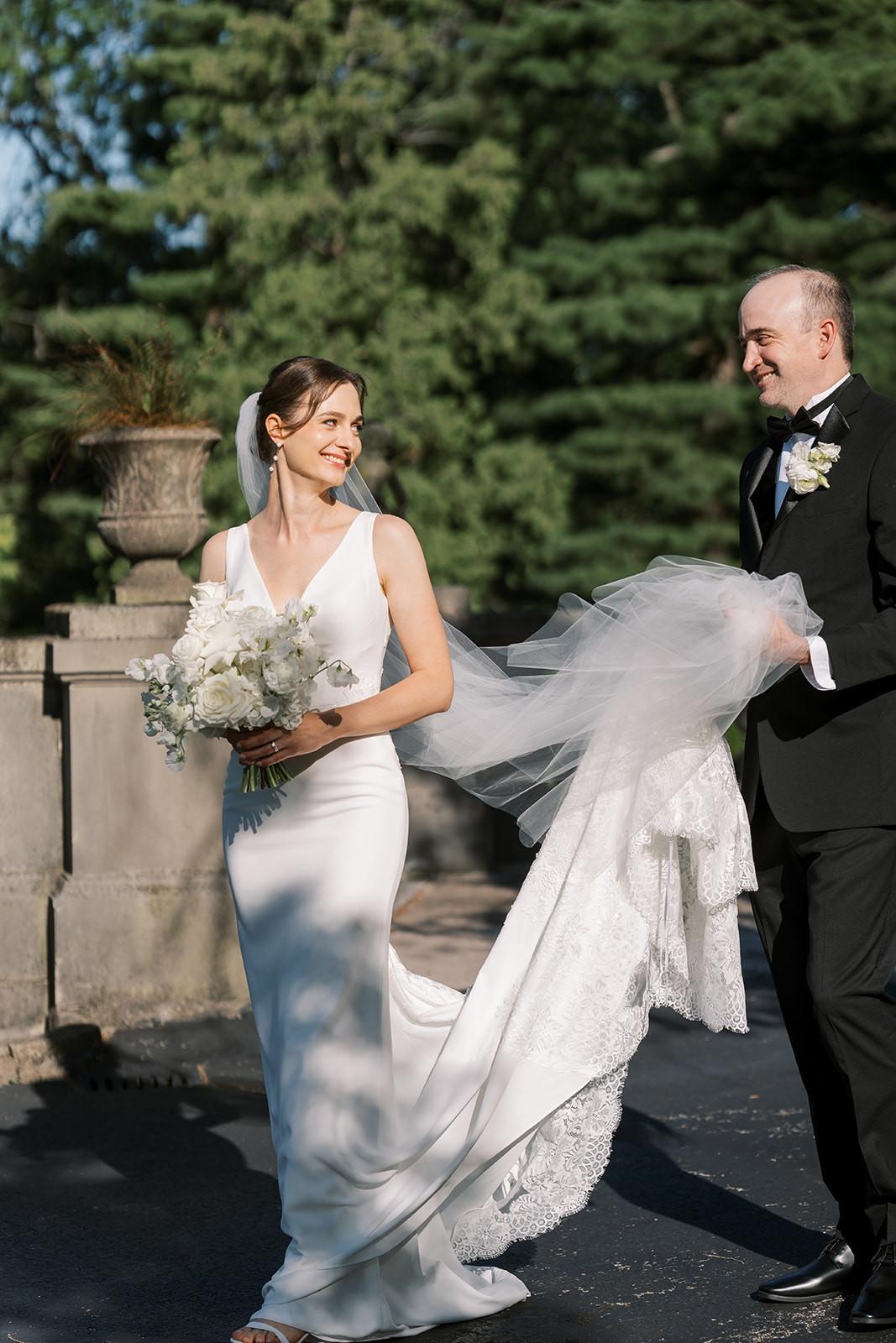 Michael and Julia walking together through the grounds at Laurel Court