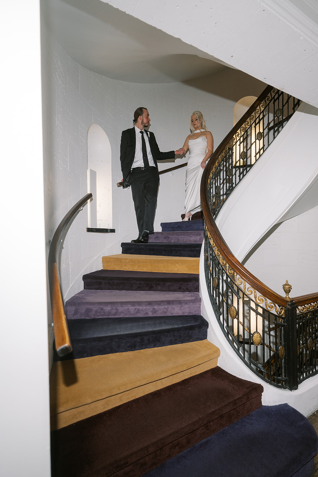 Niamh and Titus together on the curved staircase at 21c Museum Hotel Cincinnati