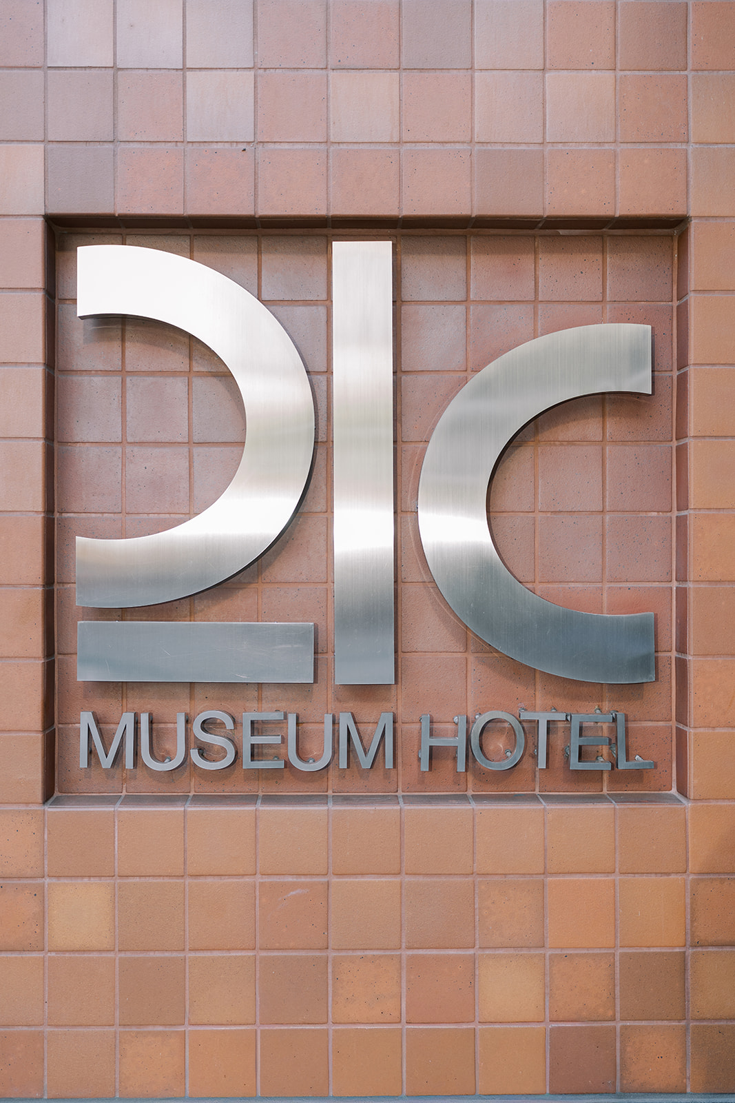 21c Museum Hotel Cincinnati exterior sign photographed on Niamh and Titus's wedding day