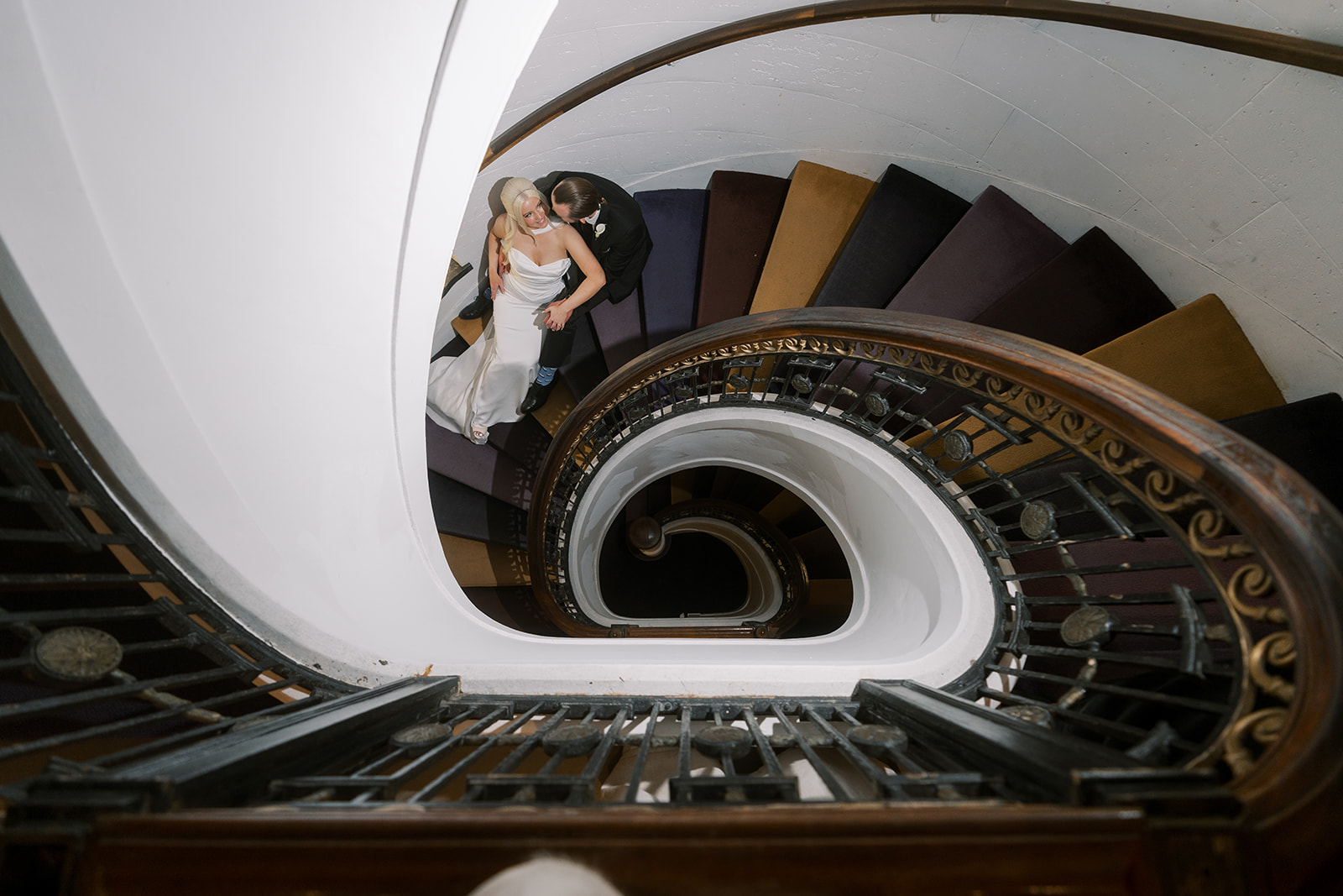 Overhead view of Niamh and Titus on the spiral staircase at 21c Museum Hotel Cincinnati