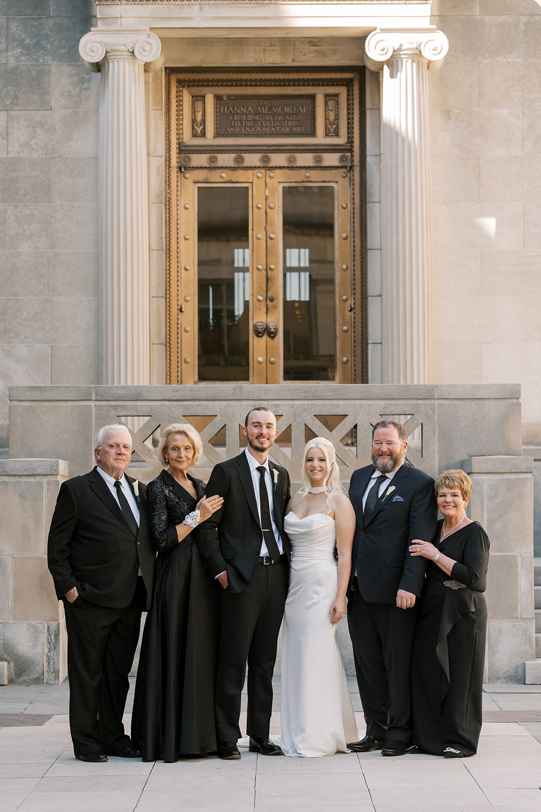 Vertical family portrait with Niamh and Titus outside Cincinnati Art Museum